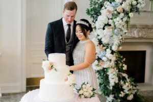 bride and groom cut their wedding cake