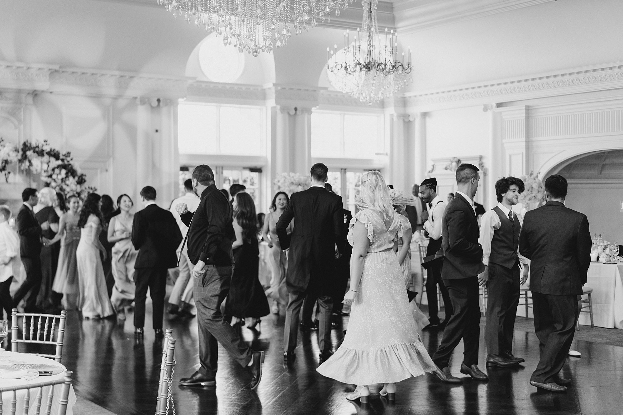 wedding guests dance and celebrate newlyweds