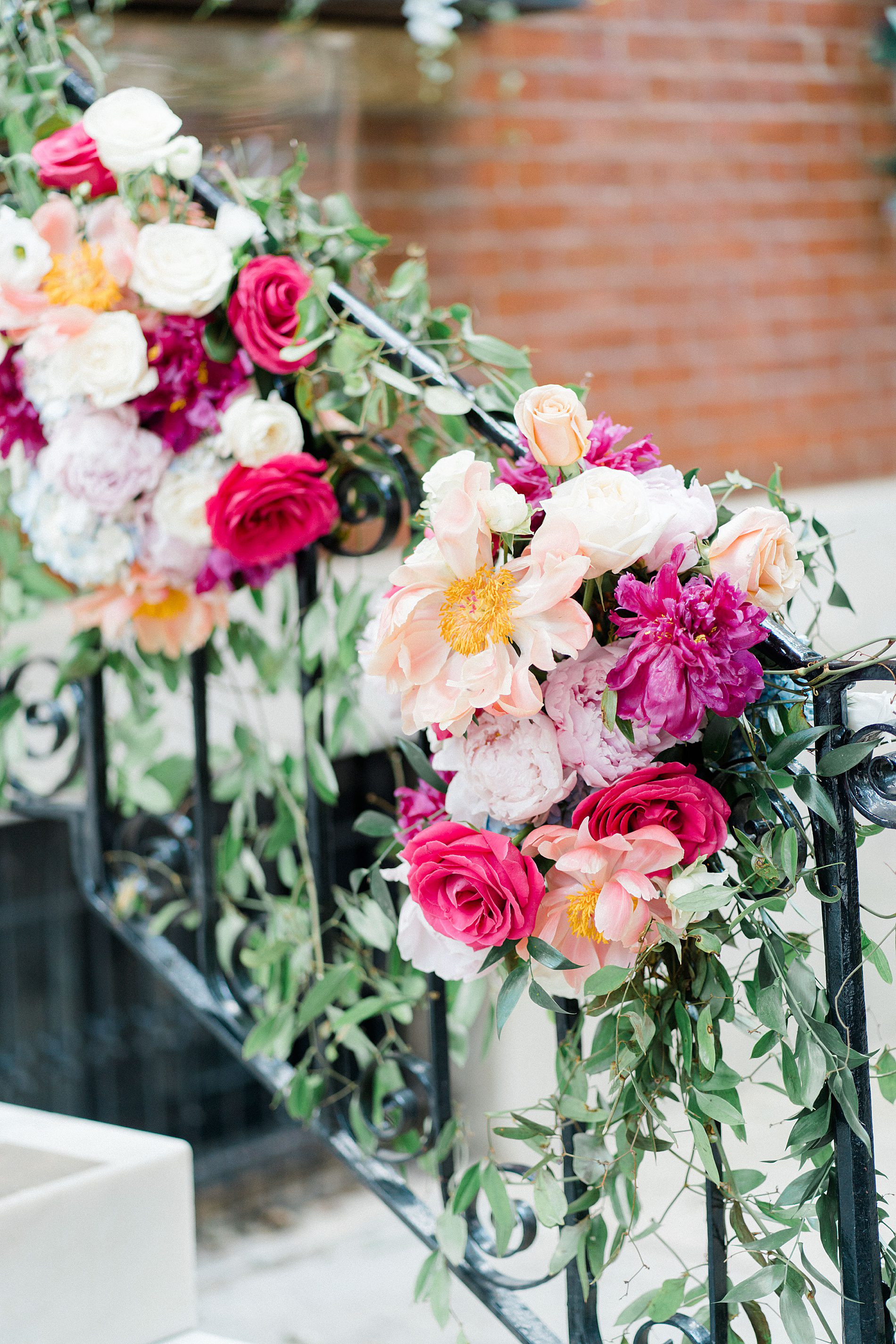 bright summer wedding flowers leading into Vaux Studio Wedding