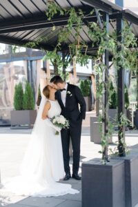 couple kiss before Philadelphia wedding