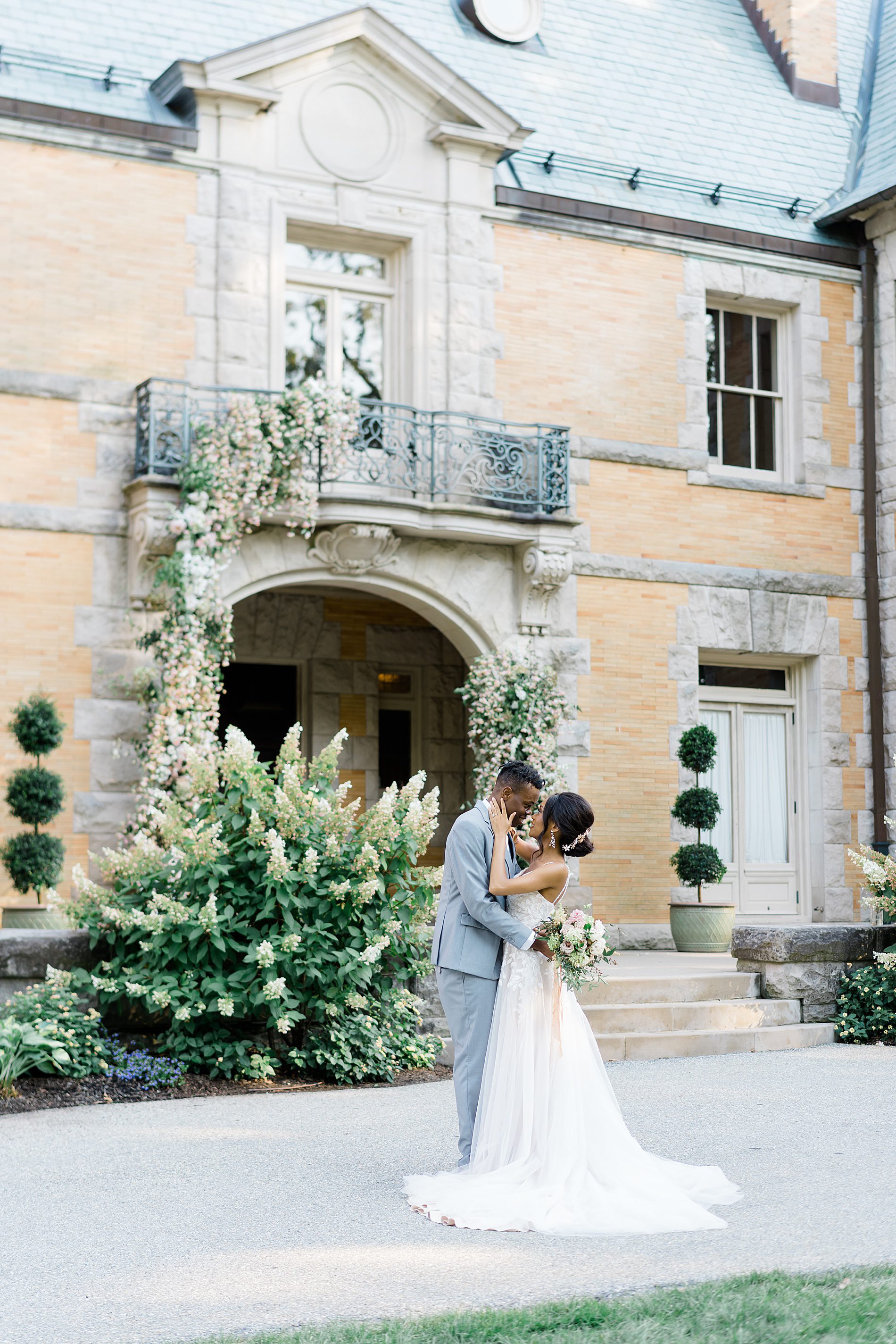 newlyweds in front of PA wedding venue Cainwood Estate