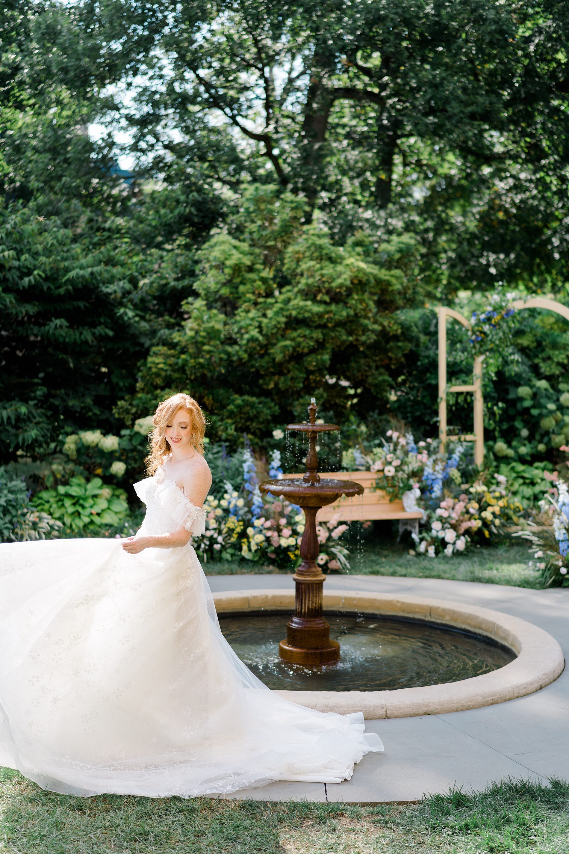 bridal portraits in front of water fountain