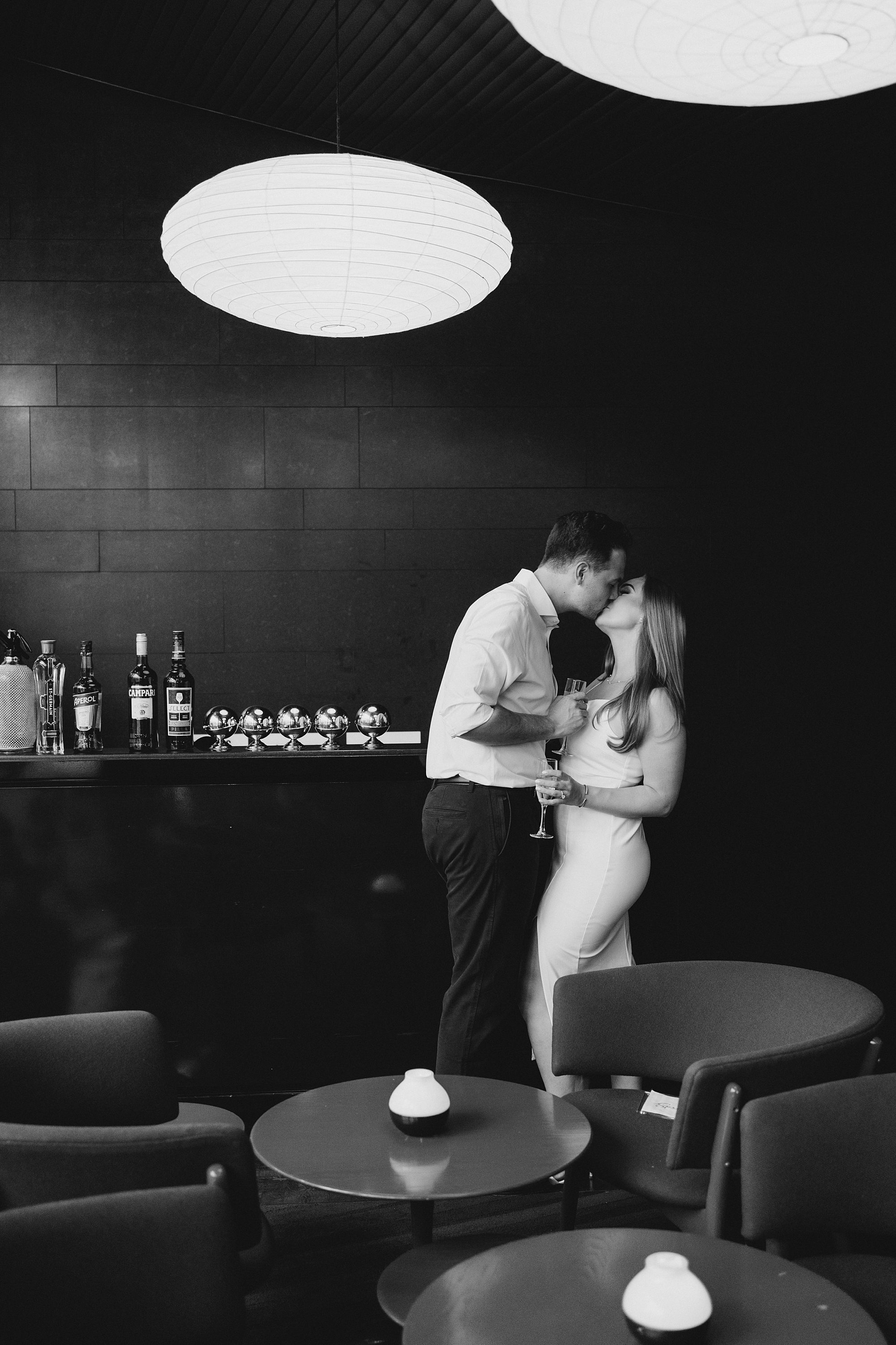 couple kiss inside NYC restaurant