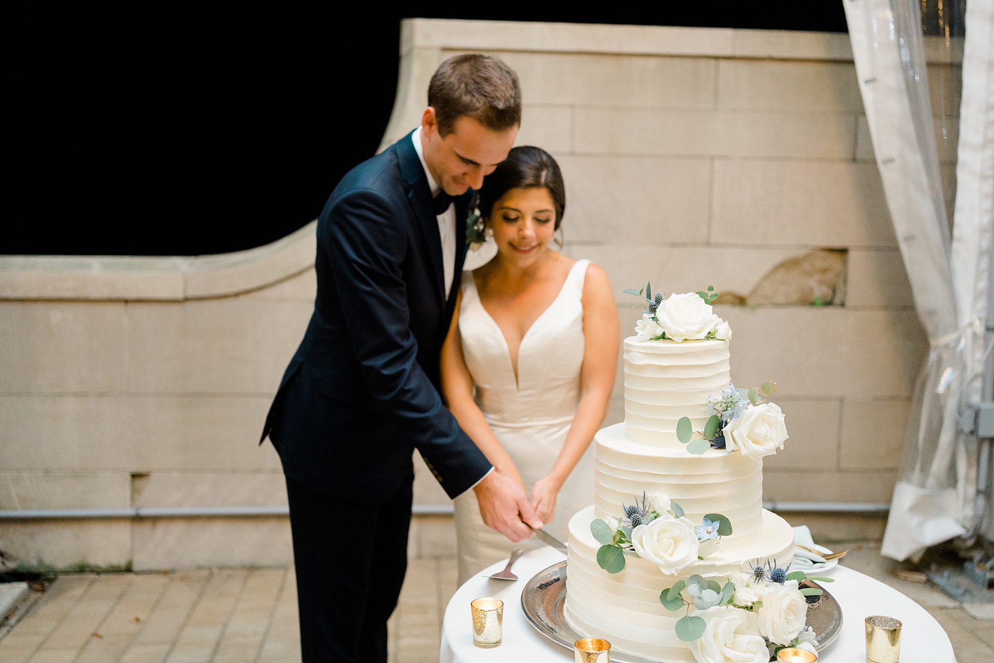 newlyweds cut their wedding cake
