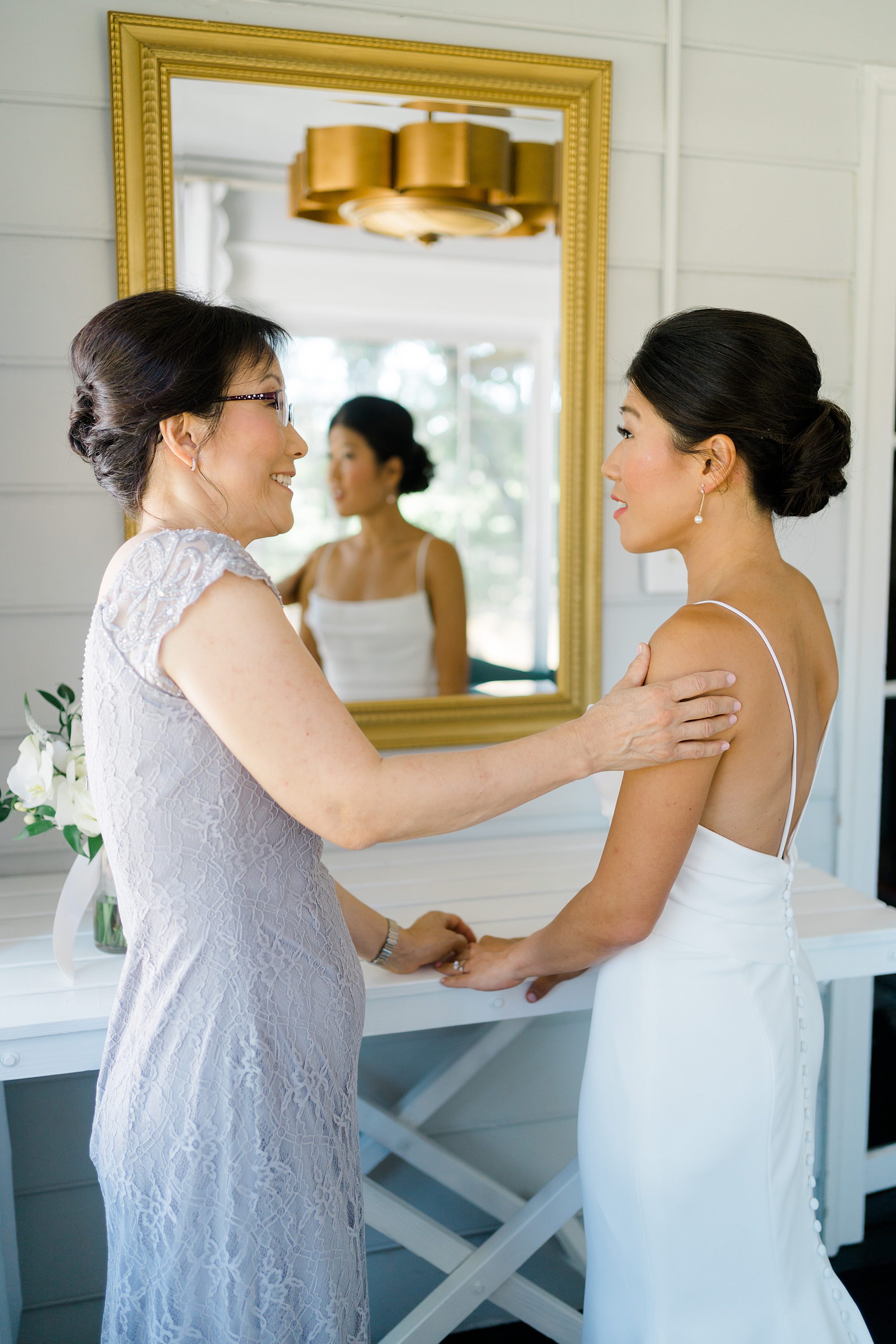 bride getting ready with mom