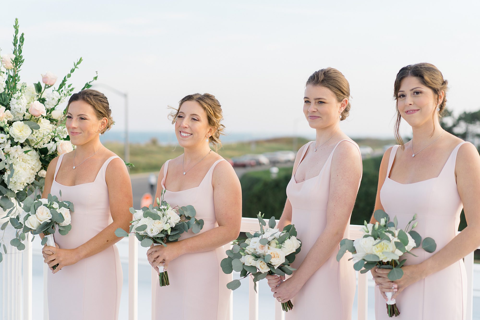 bridesmaids in dusty pink dresses