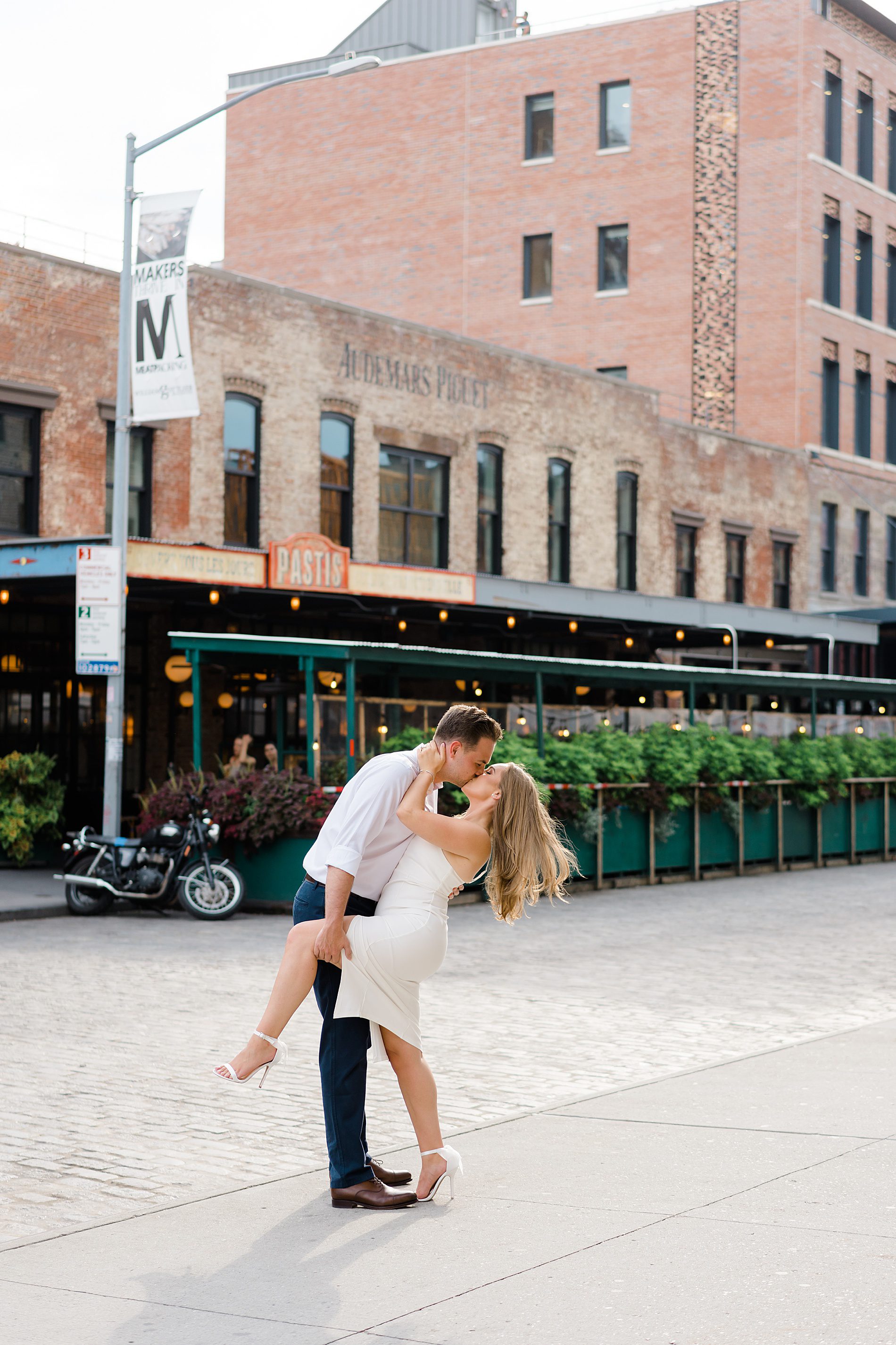 man dips his fiance in the road of New York City Engagement