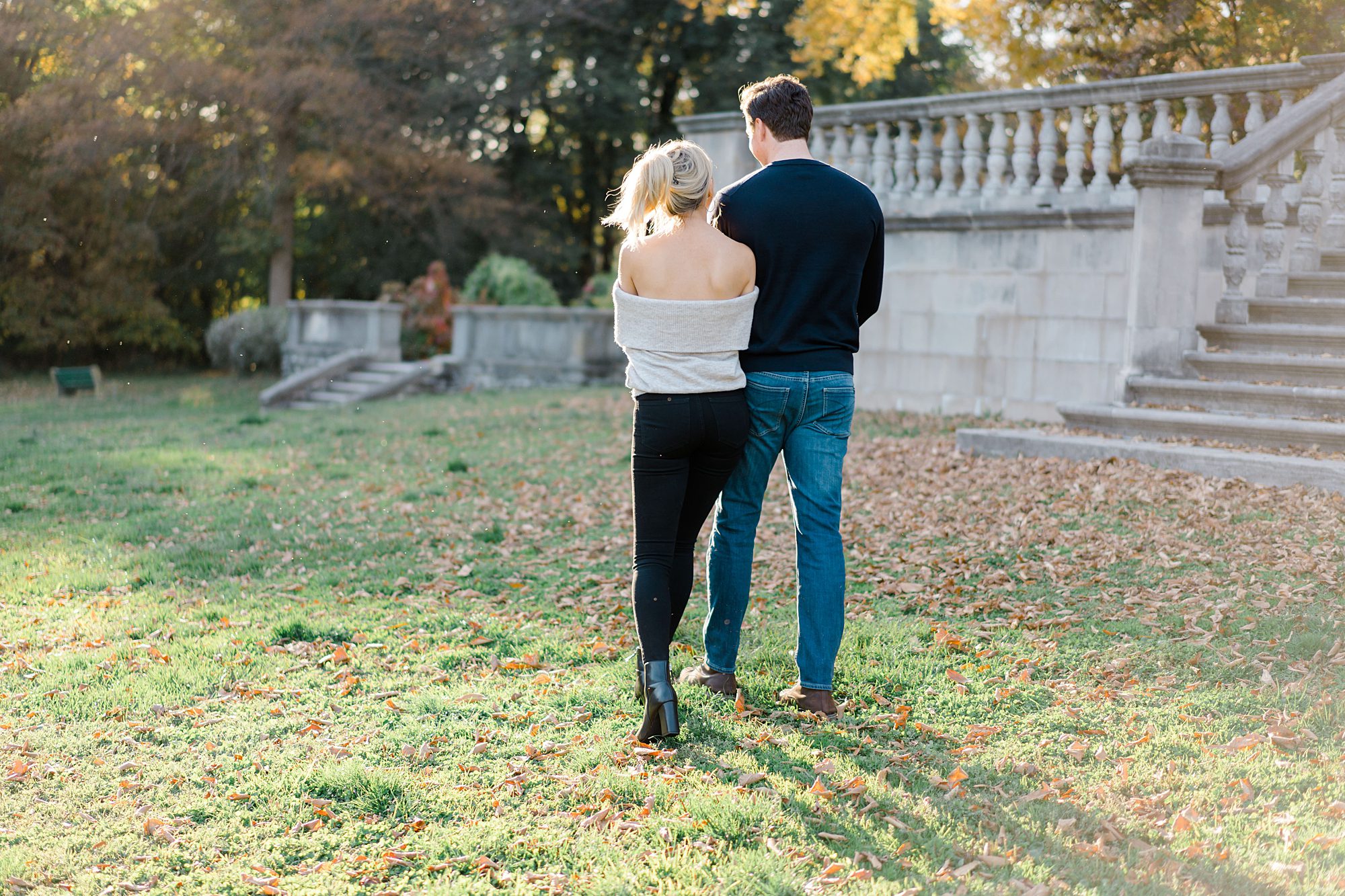 couple walking together during Fall Engagement at Curtis Arboretum