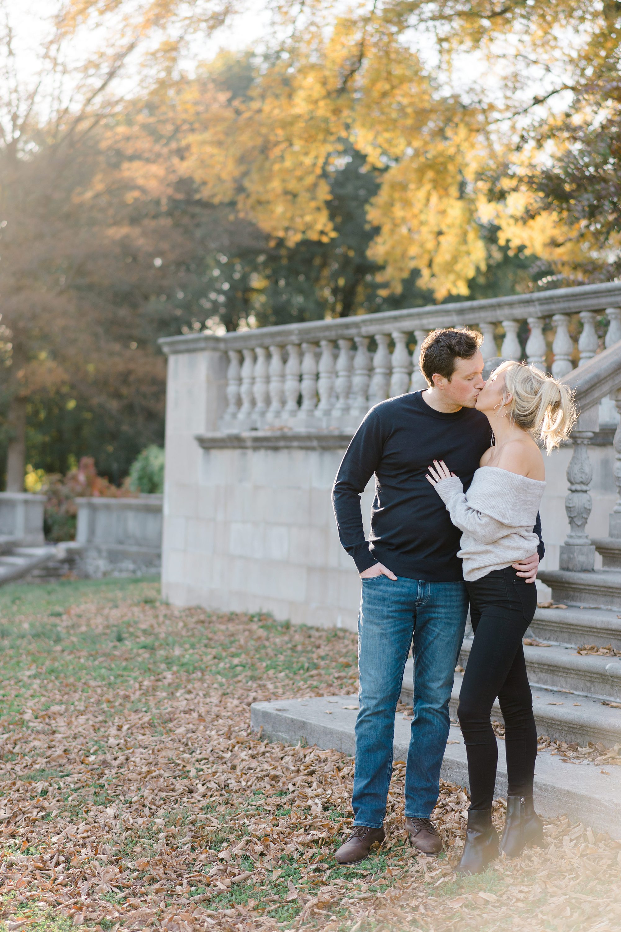 couple share kiss during engagement photos