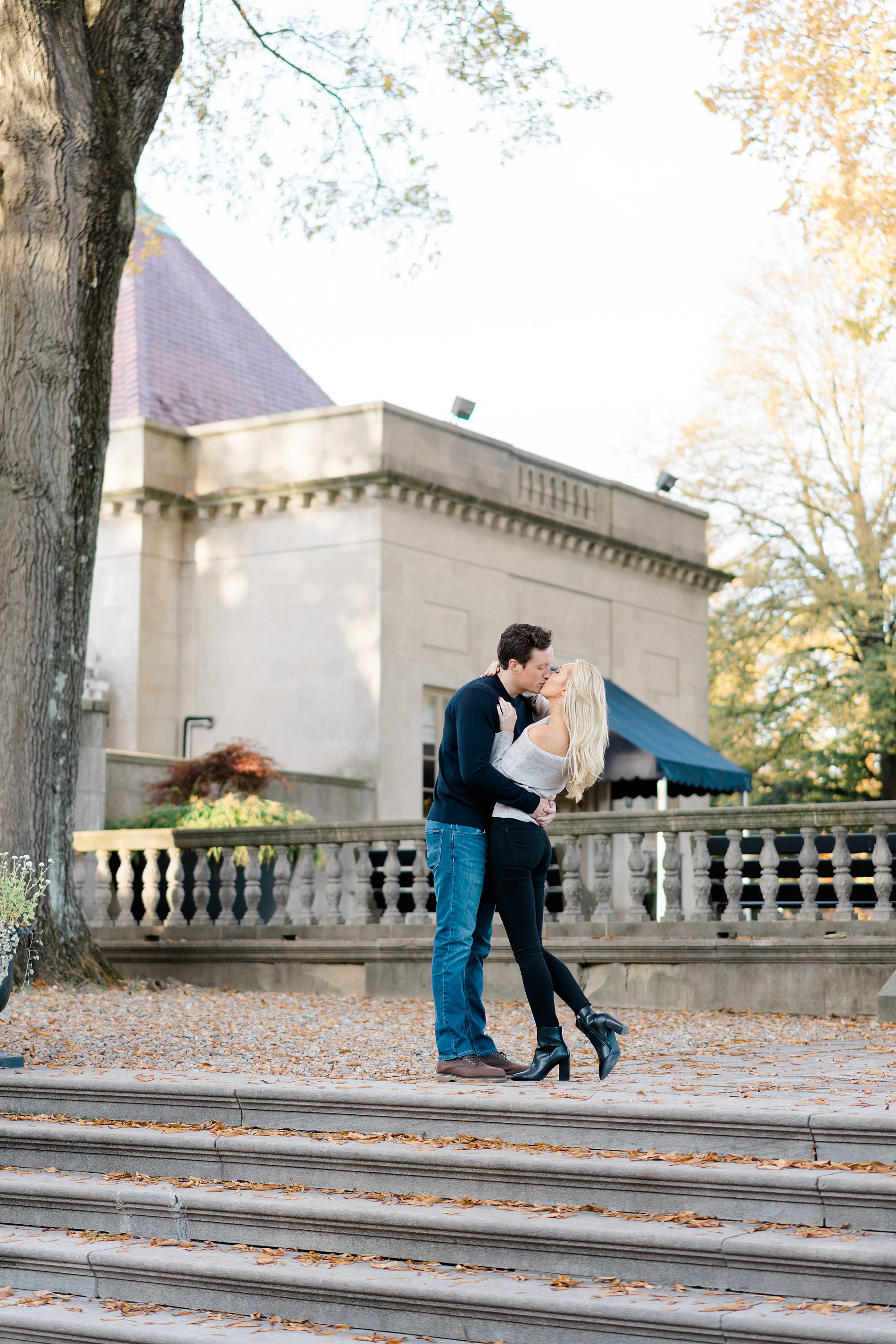couple kiss at Curtis Arboretum fall engagement session