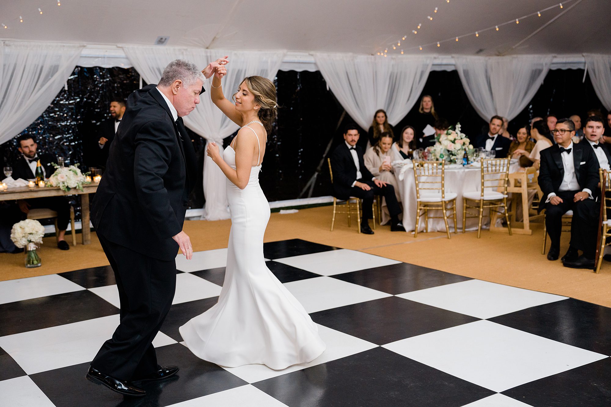 bride dances with father at wedding reception