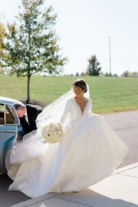bride exits car to go to church