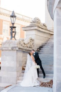 couple kiss during wedding portaits