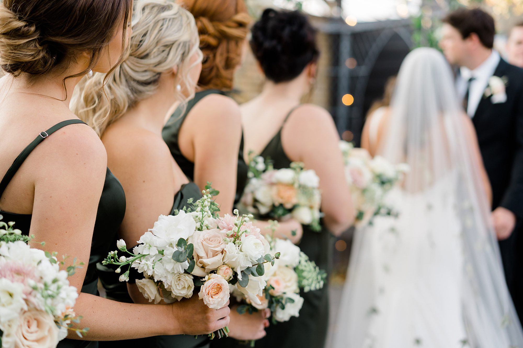 bridesmaids standing during outdoor wedding ceremony