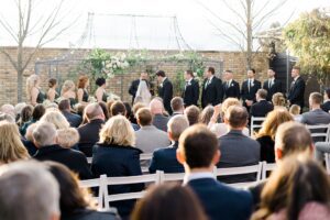 outdoor wedding ceremony at wedding arch at outdoor ceremony at Terrain Gardens at Devon Yard