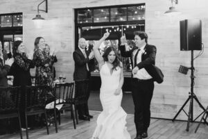 newlyweds dance as they enter wedding reception