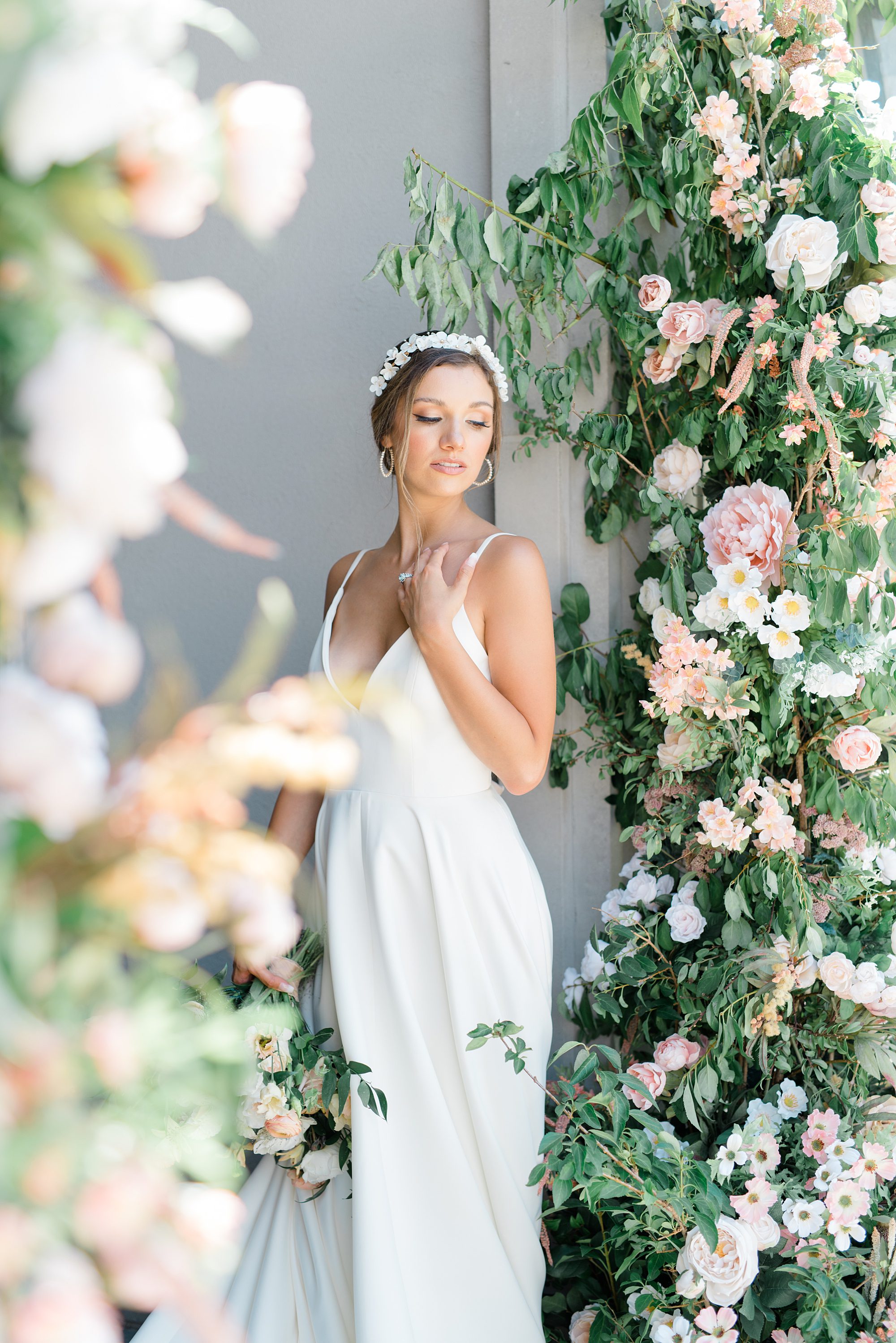 bride surrounded by elegant flowers