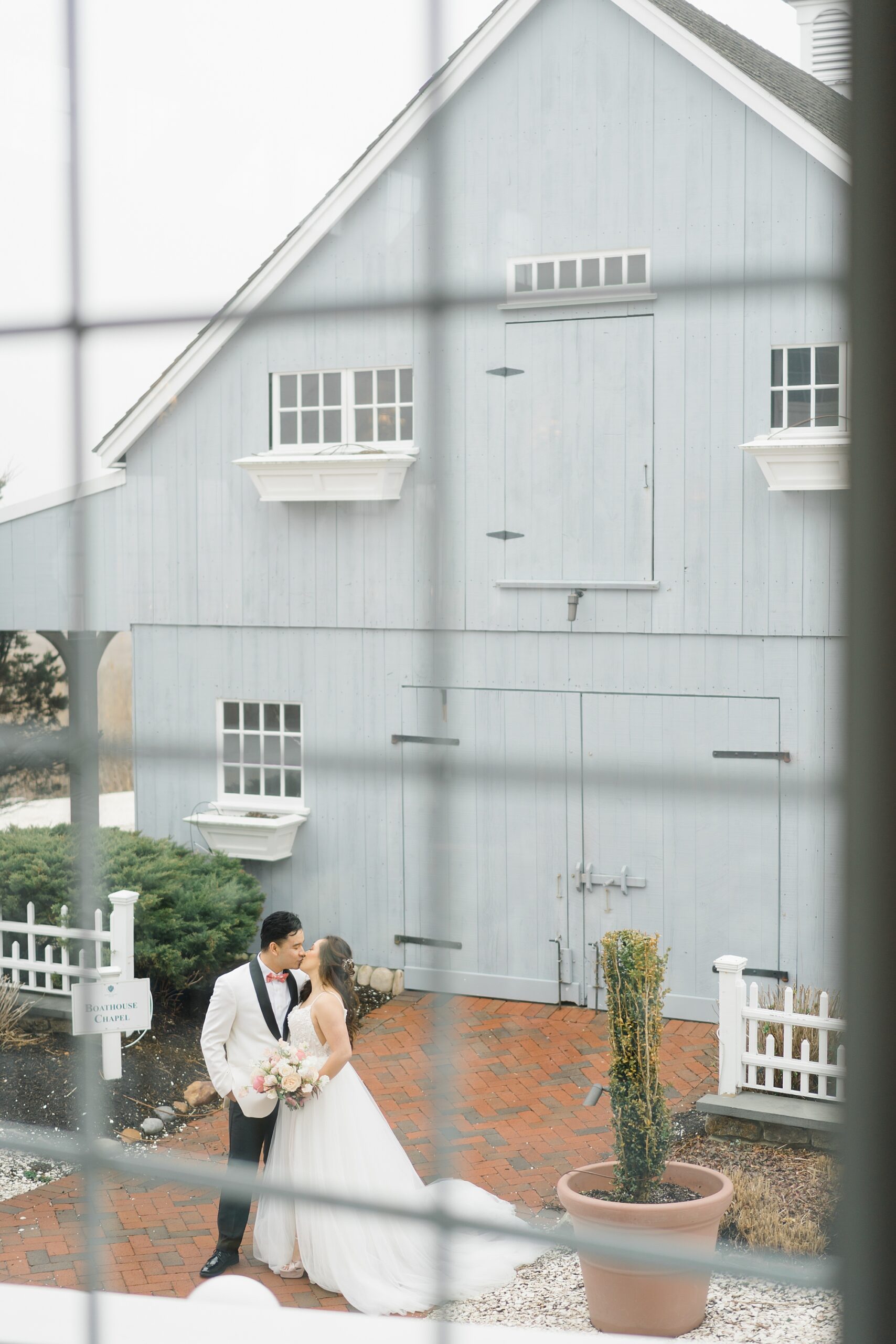 newlyweds outside the Boathouse Chapel 