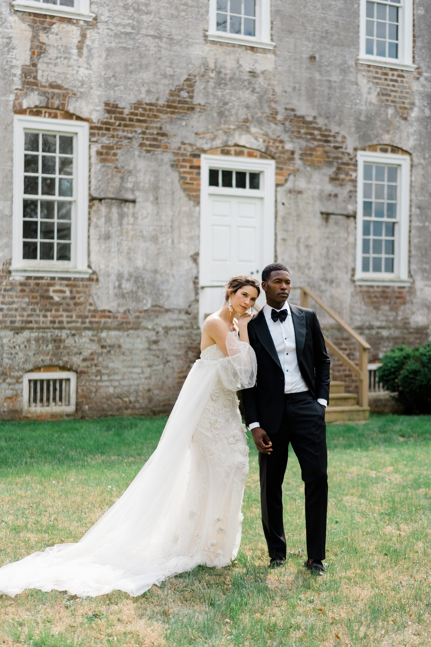 bride and groom stand in front of Historic Salubria