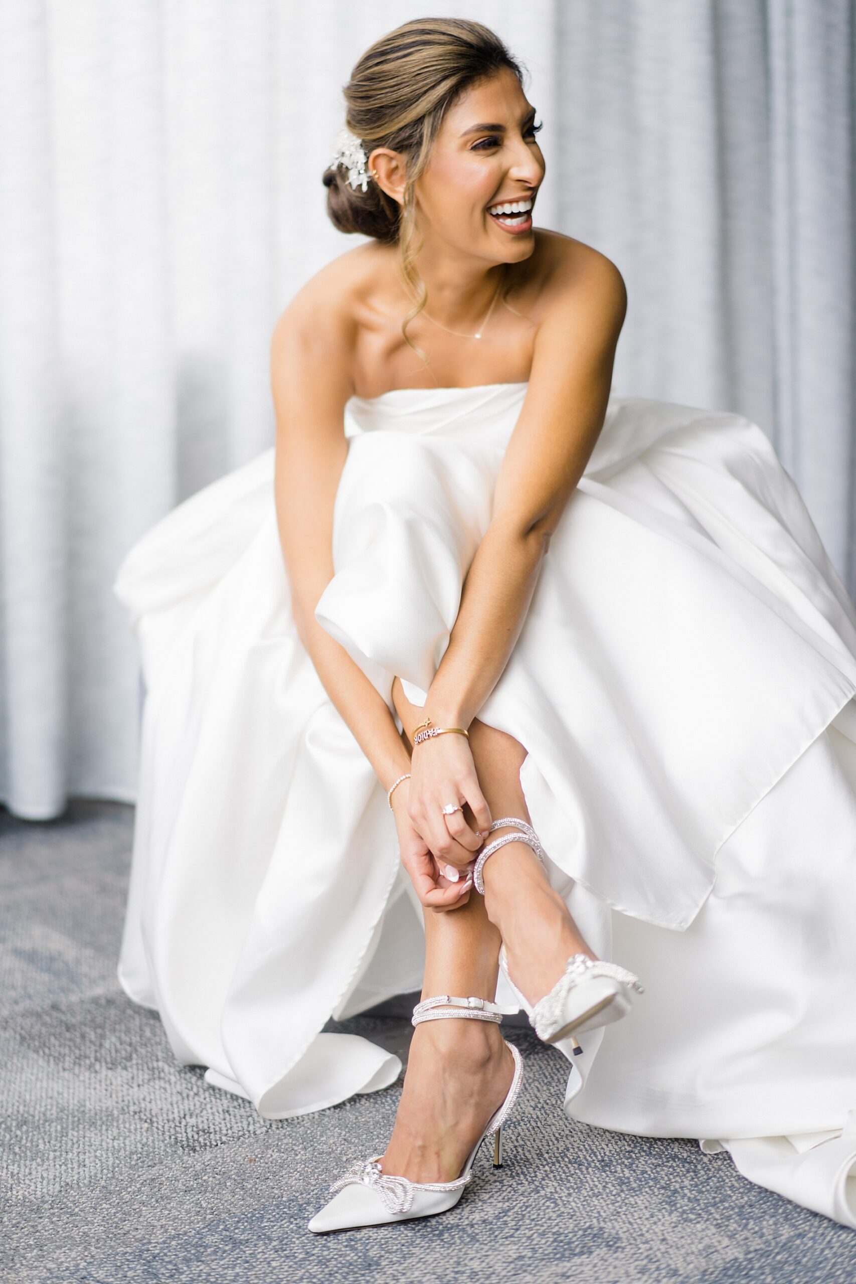 candid bridal portraits as she puts her shoes on
