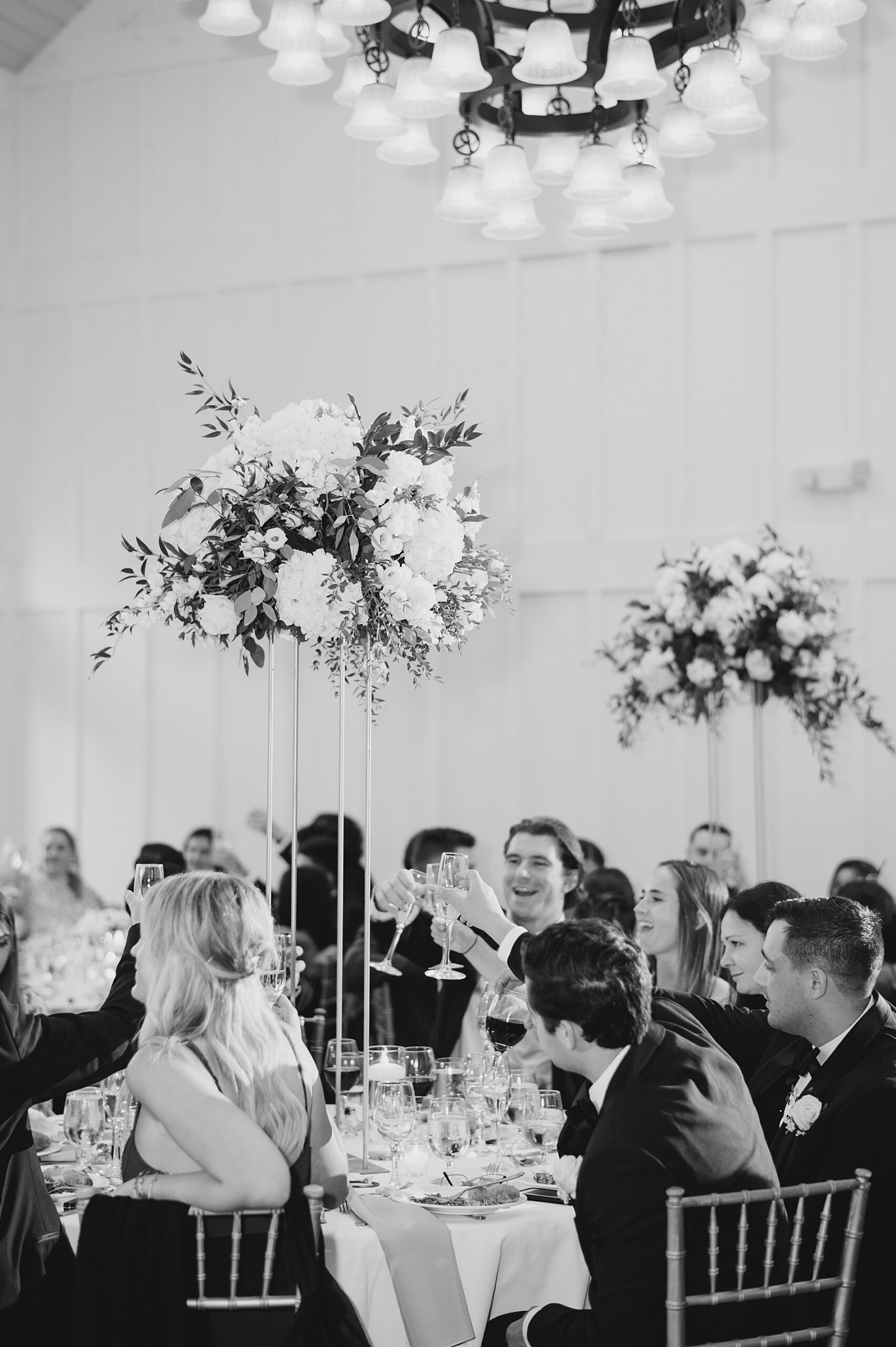 guests toast during Elegant Coach House Wedding at the Ryland Inn