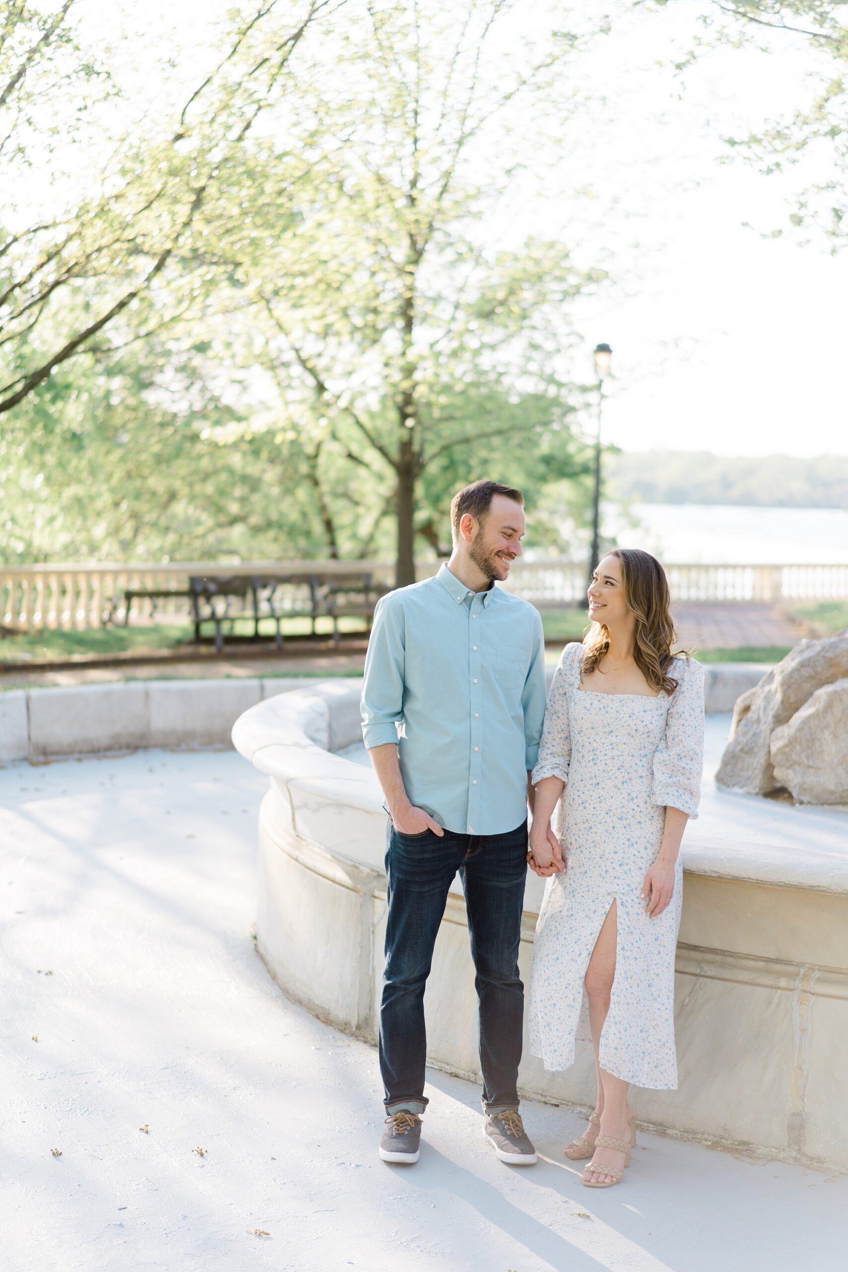 couple hold hands in downtown Philadelphia during engagement session
