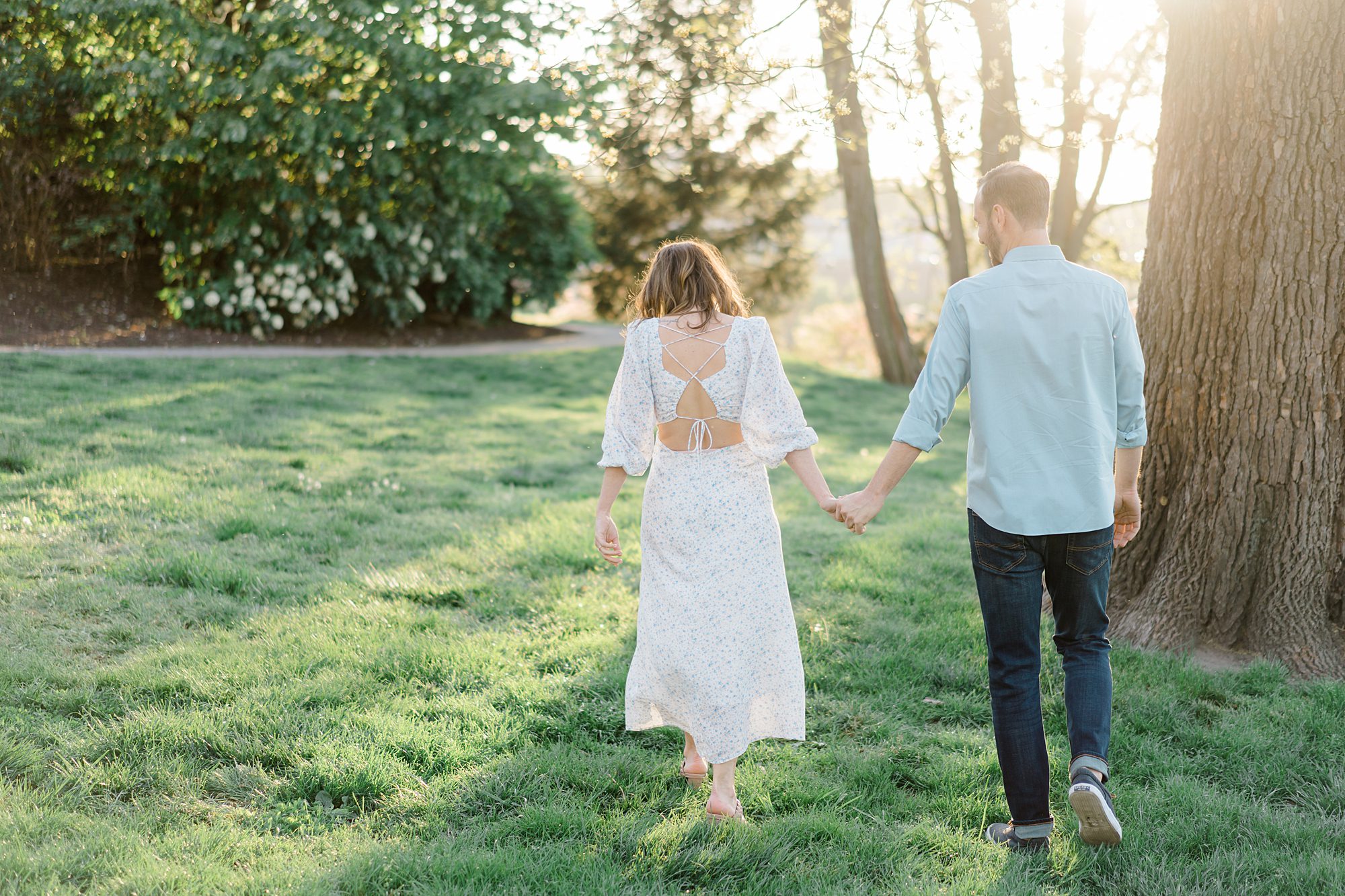 engaged couple hold hands during Light + Airy Philadelphia Engagement