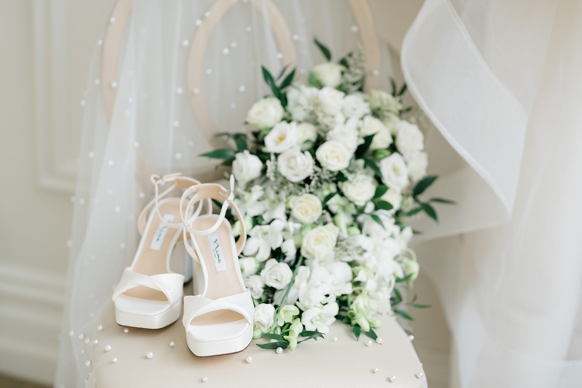 wedding shoes and white bridal bouquet from Estate at Florentine Gardens Wedding