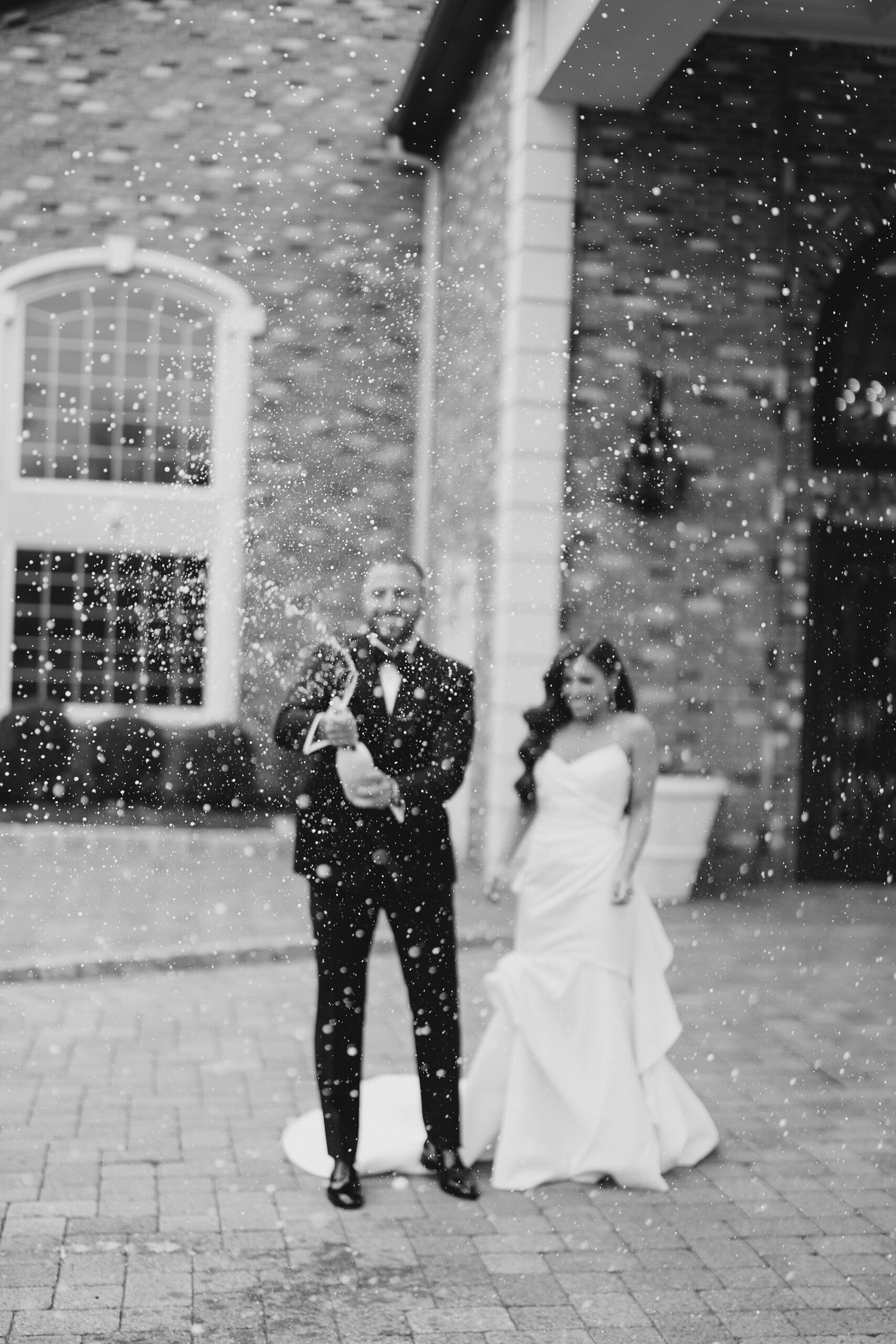 bride and groom celebrate with champagne