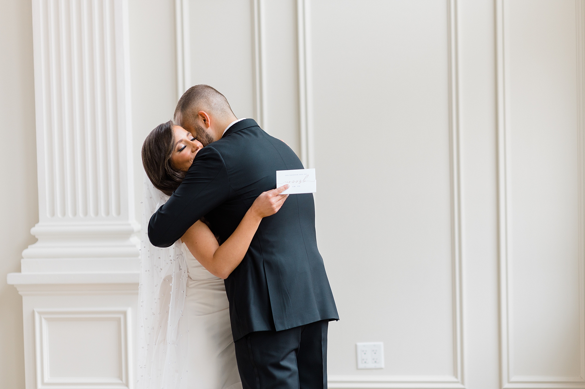 bride and groom hug during private vow exchange