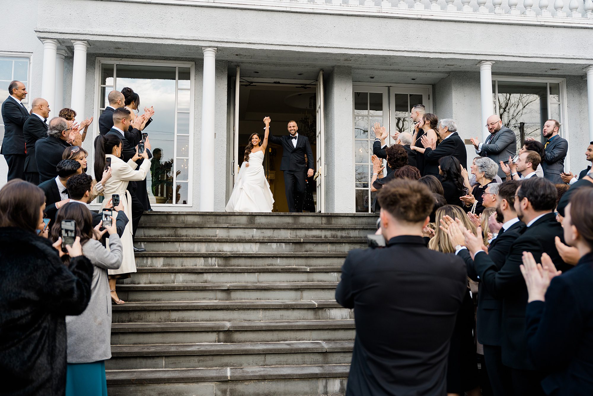 wedding guests celebrate newlyweds exiting church