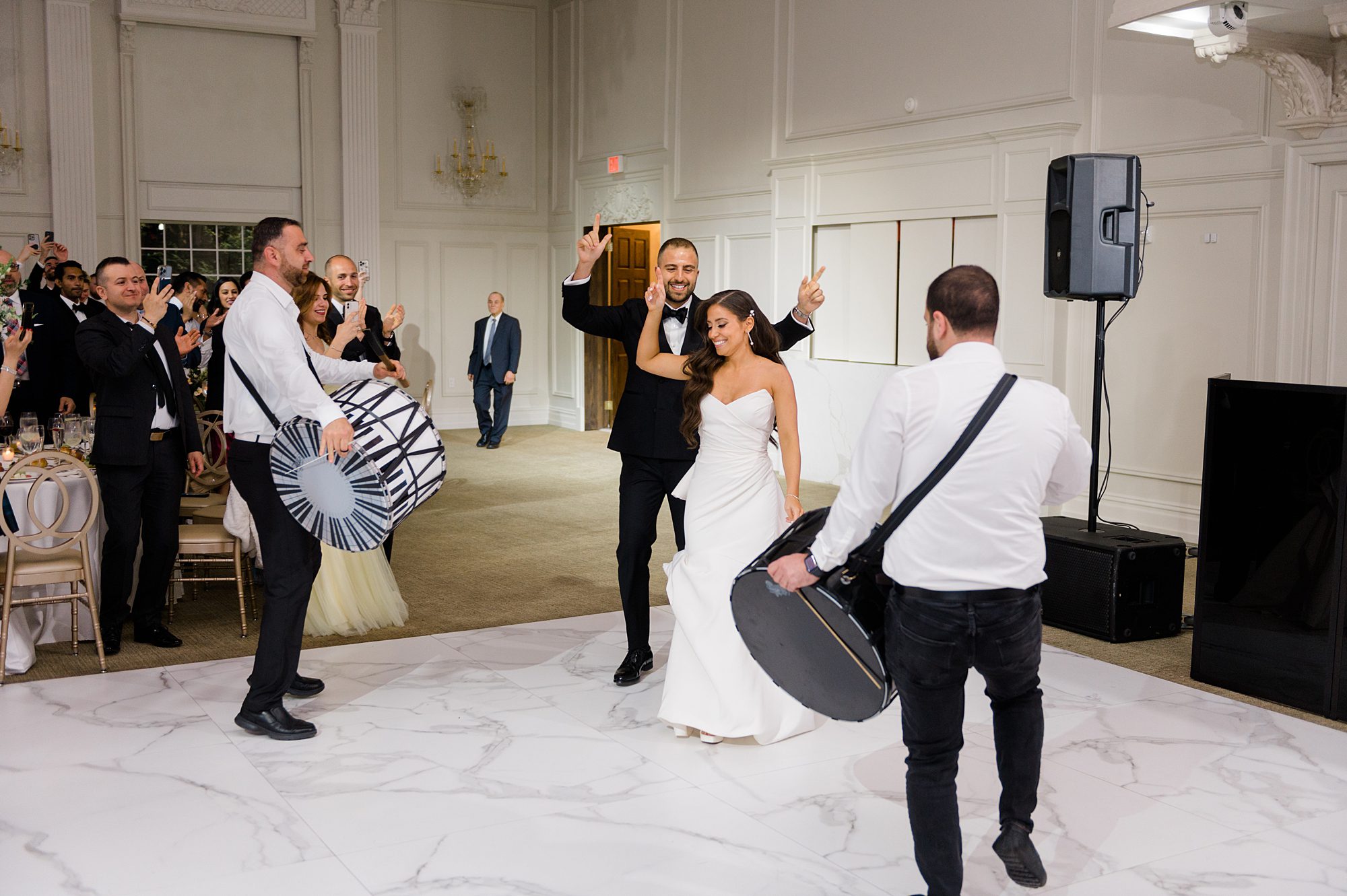 bride and groom enter wedding reception at Estate at Florentine Gardens