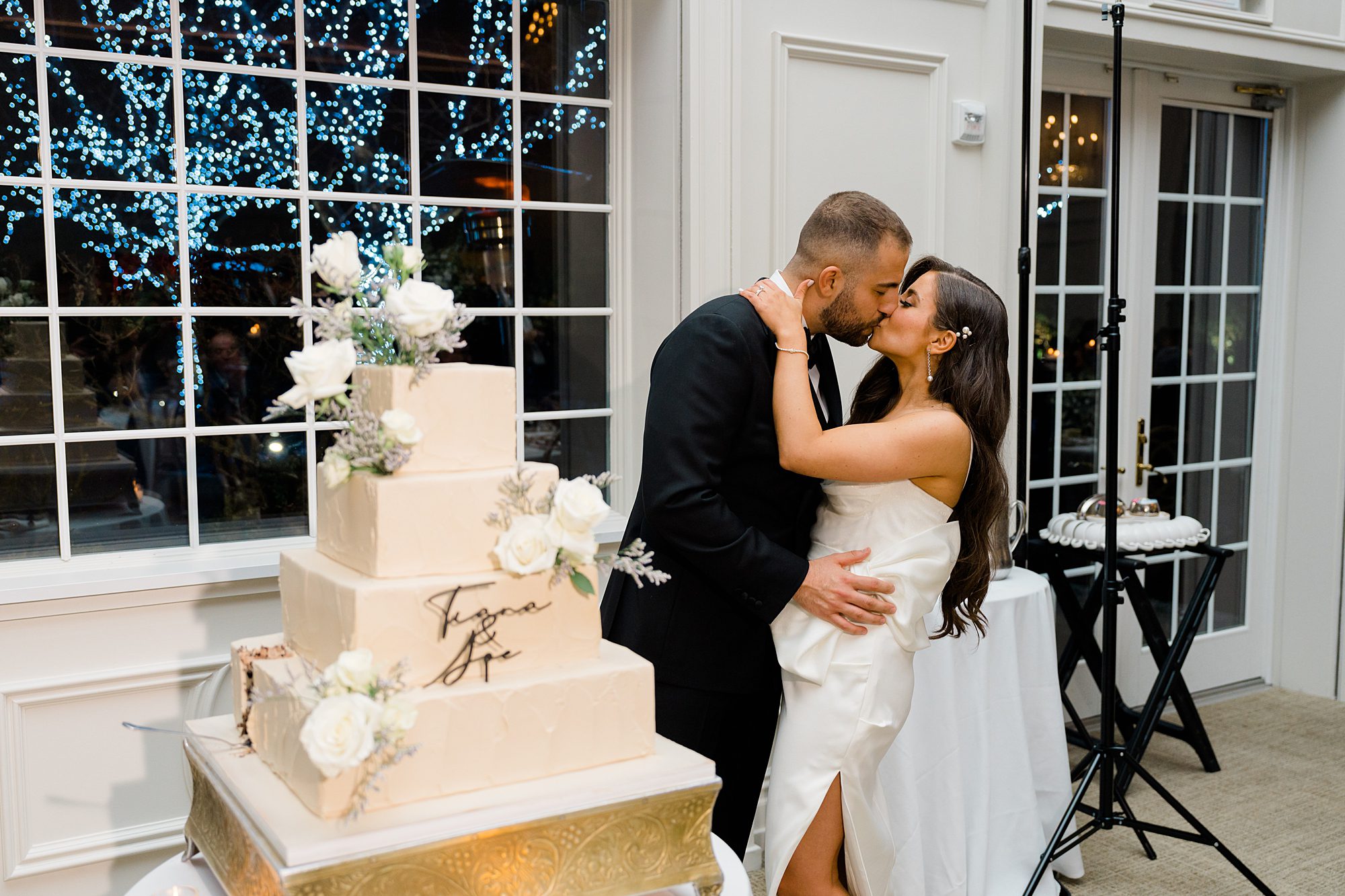 newlyweds kiss at their Estate at Florentine Gardens Wedding reception