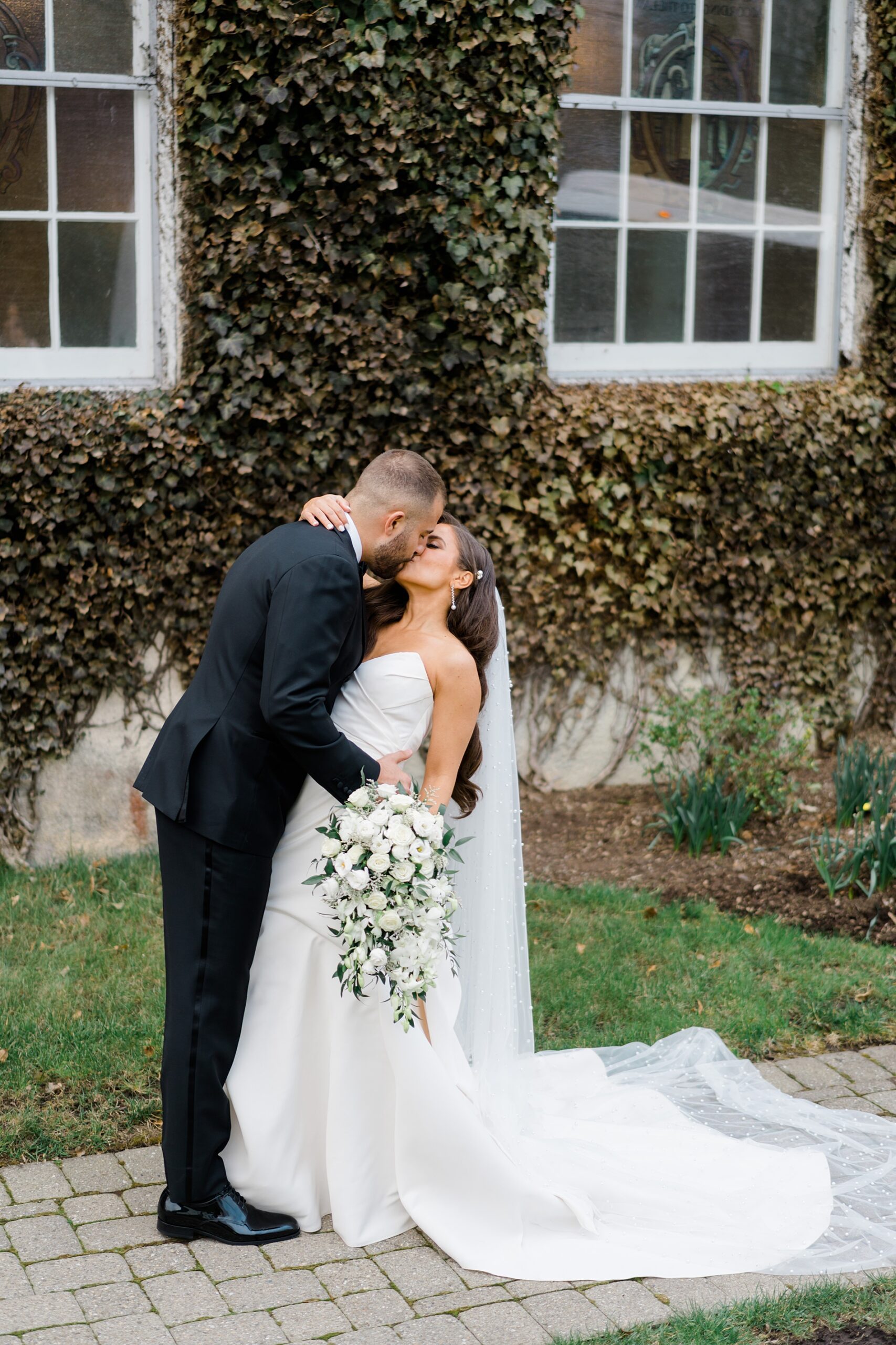 newlyweds kiss outside from New Jersey wedding