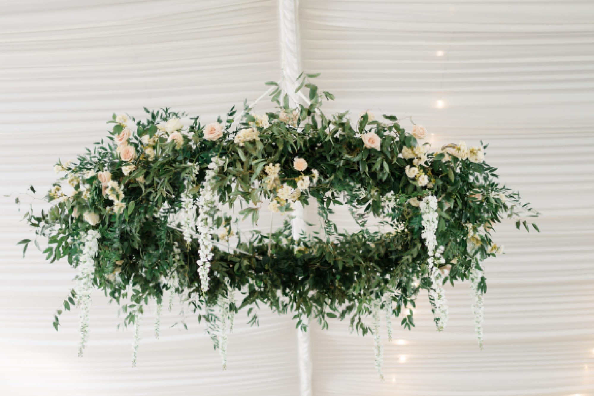 garden inspired chandelier with greenery and white flowers