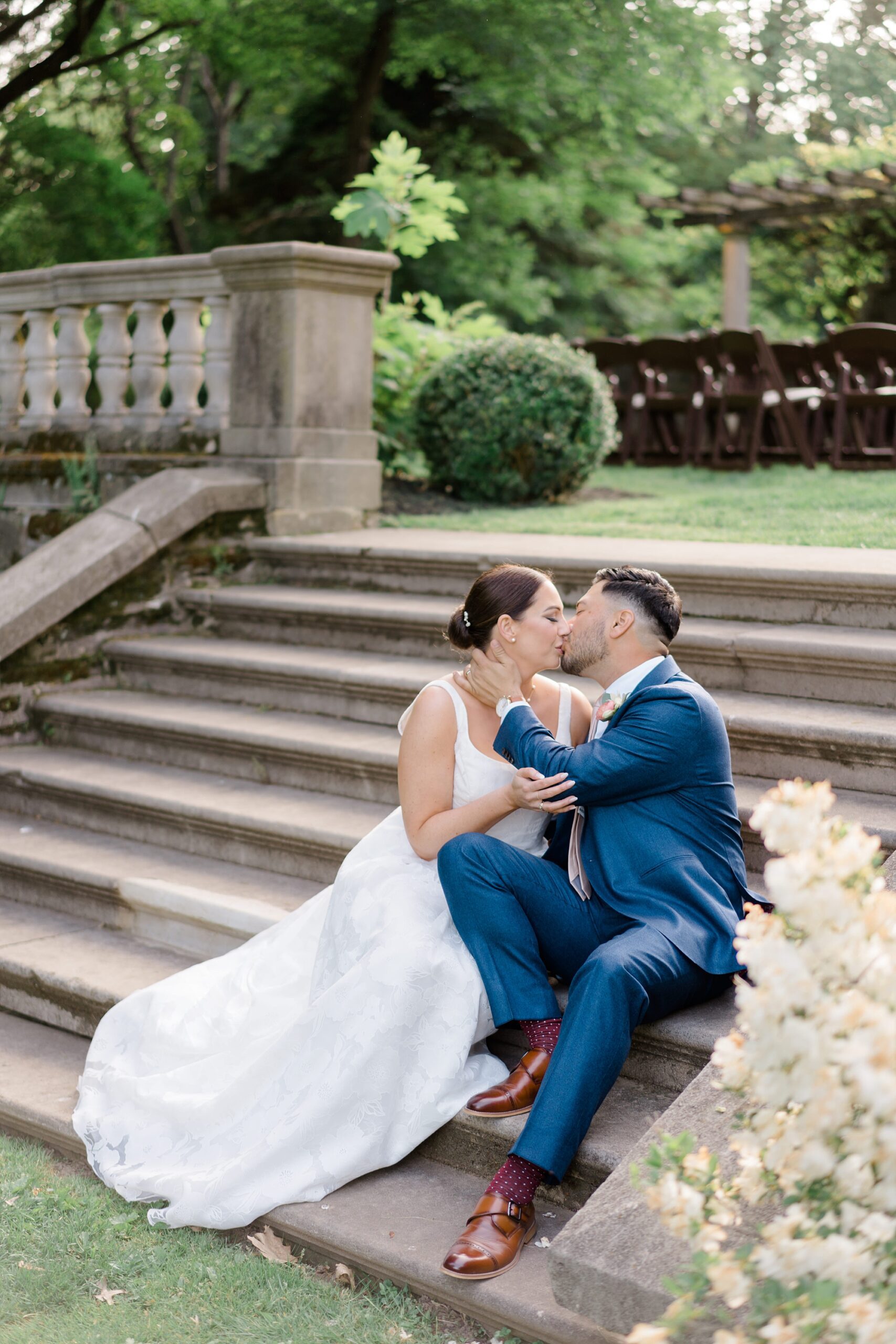 newlyweds kiss on stairs 
