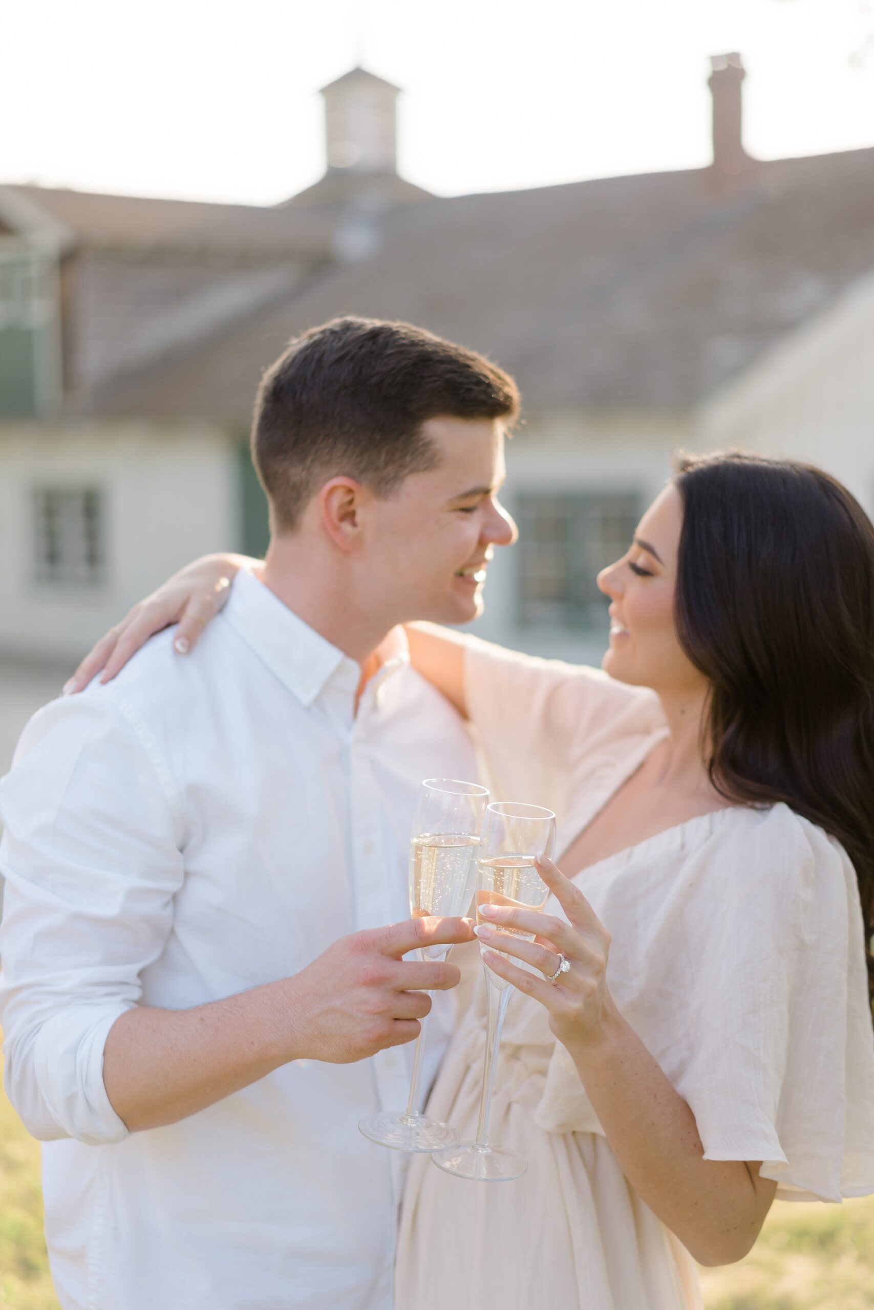 engaged couple toast champagne during session