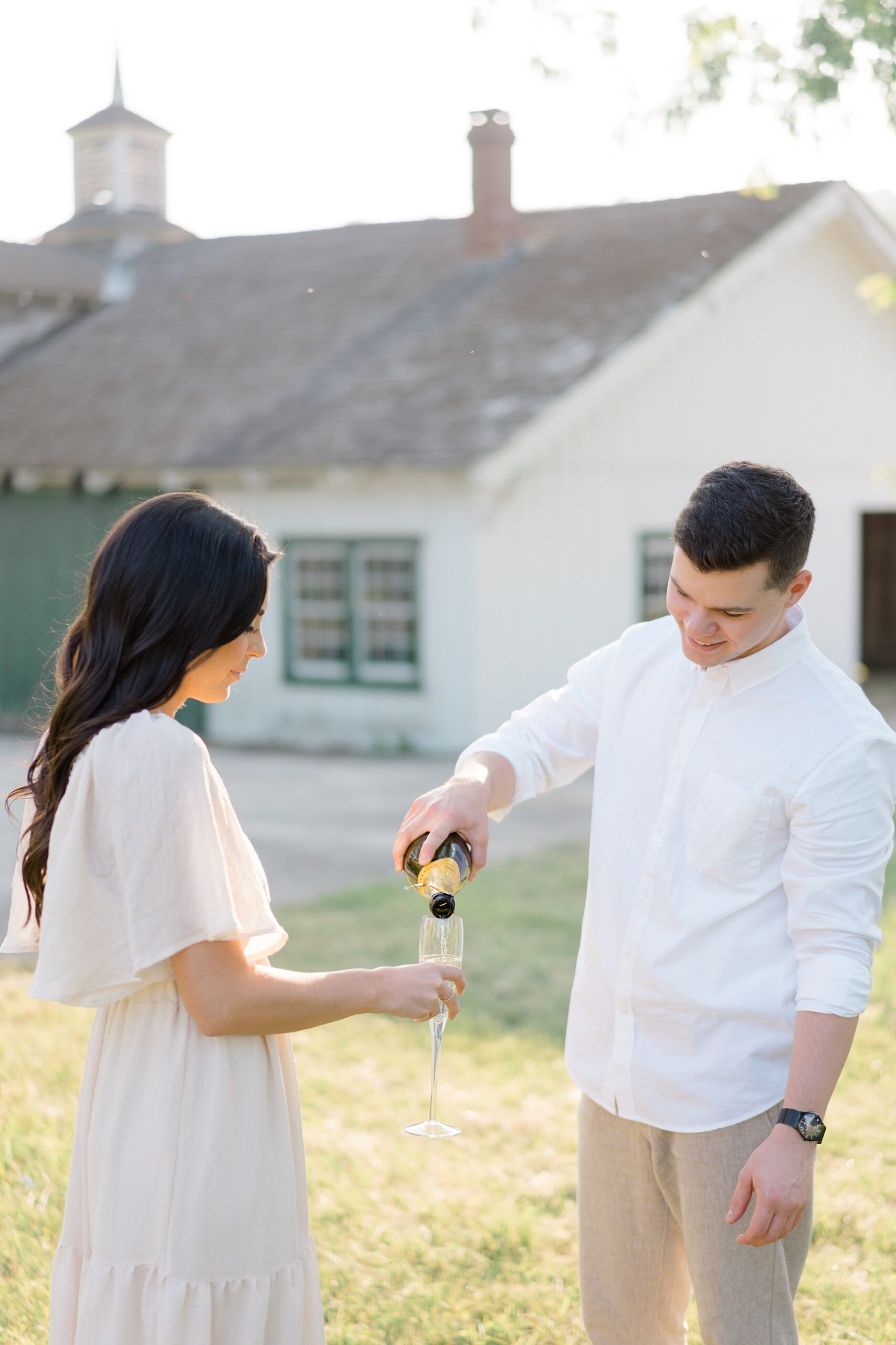 couple enjoy champagne during Intimate Valley Forge Engagement session