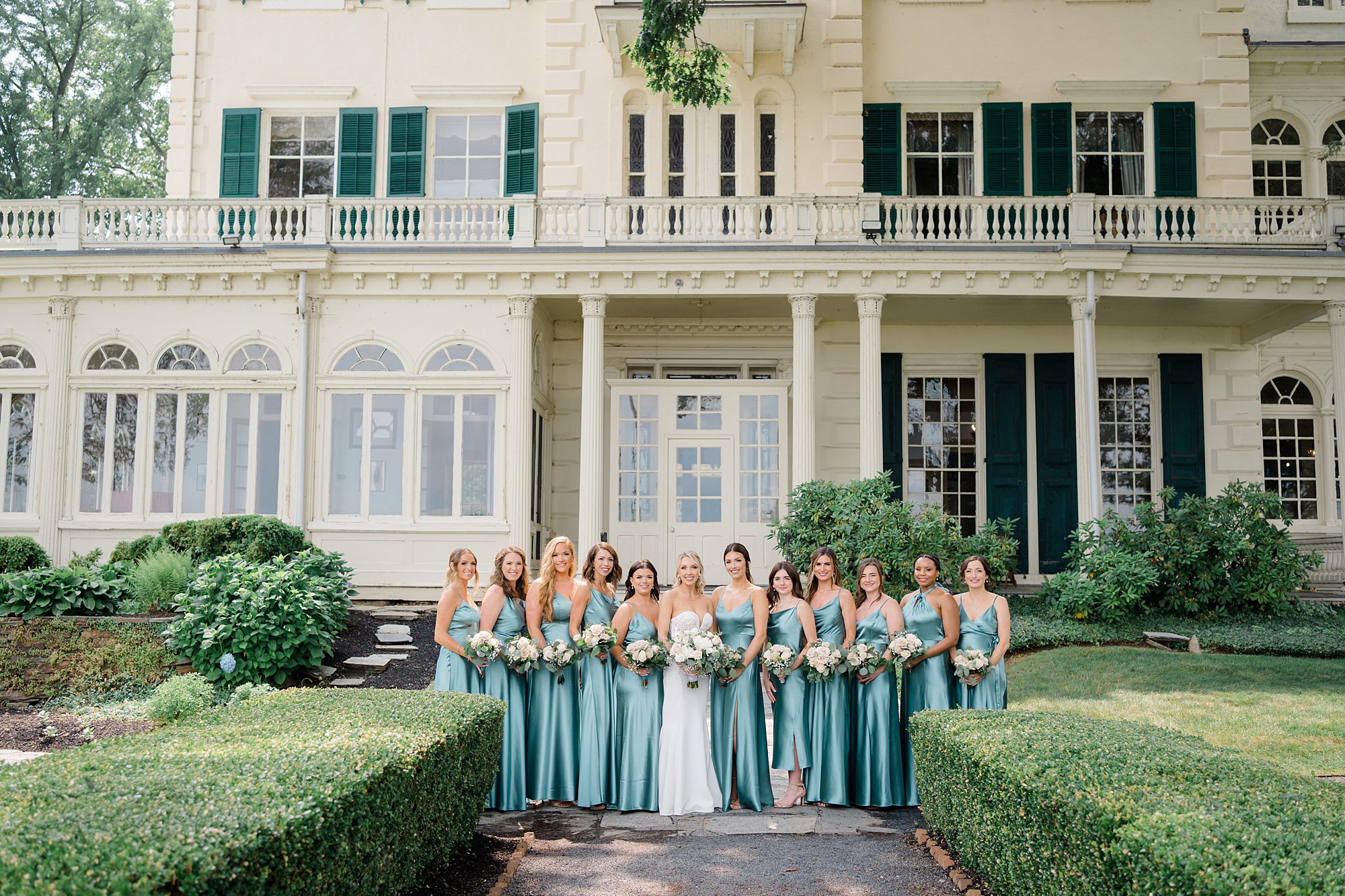 bridesmaids in front of Glen Foerd on the Delaware 