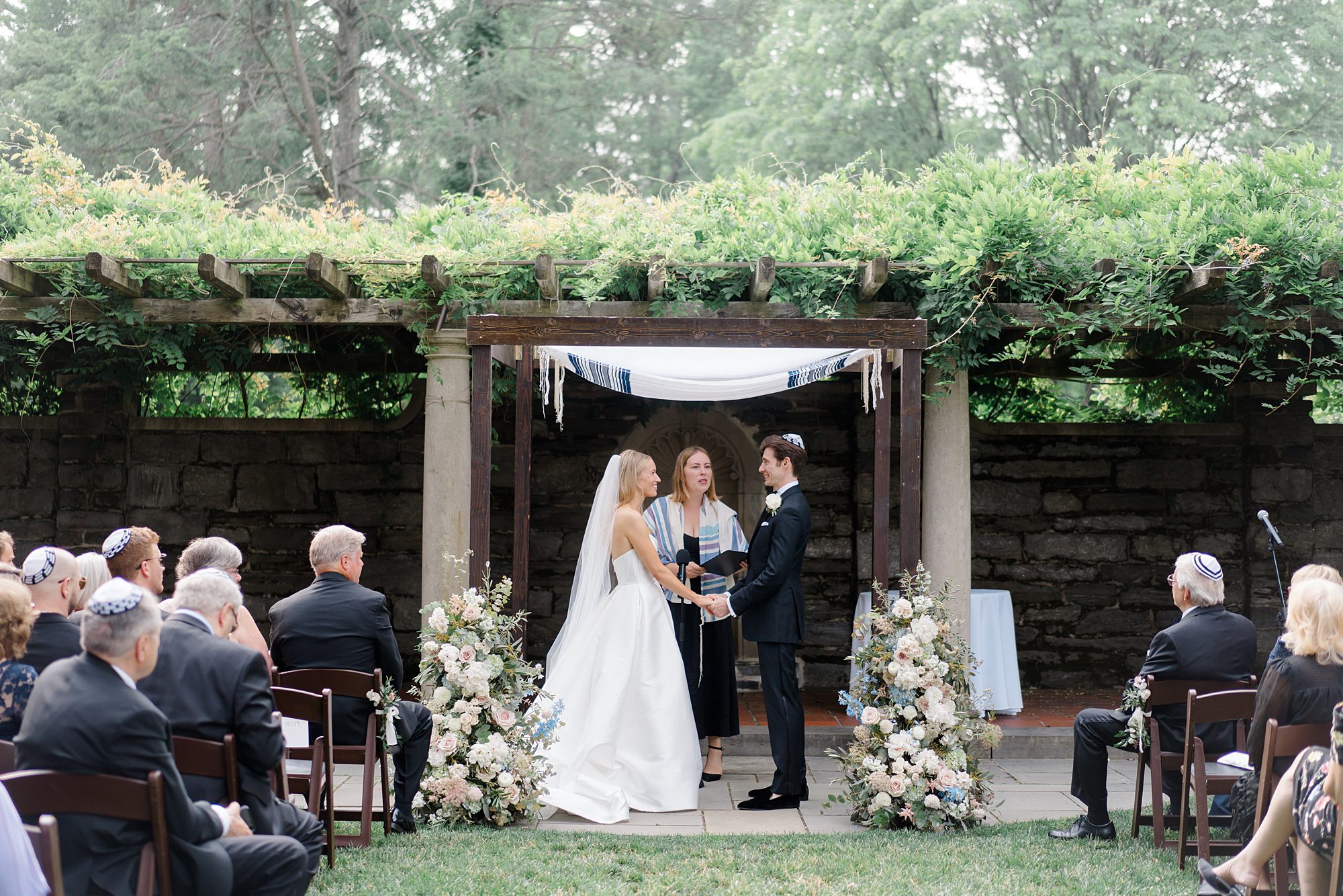bride and groom exchange vows at outdoor wedding ceremony