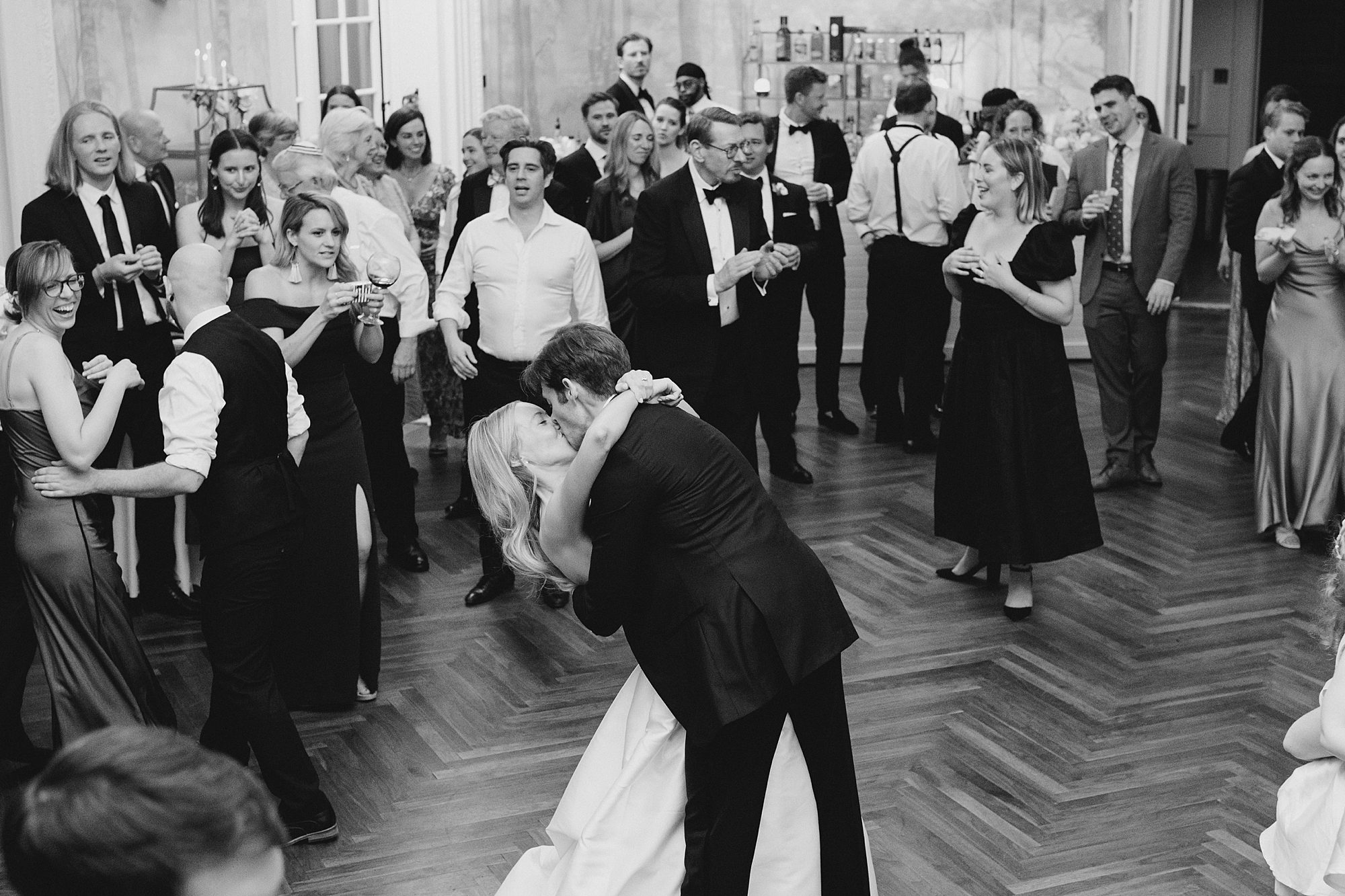 newlyweds kiss in the middle of dance floor 