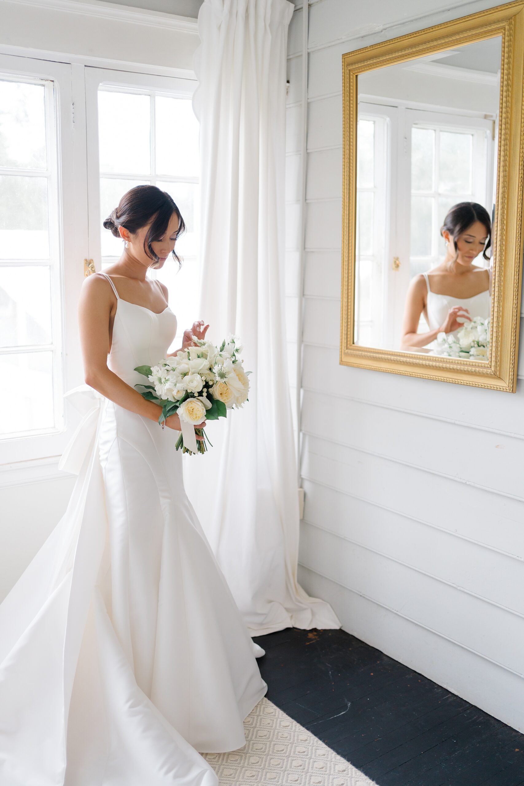 bride holding classic white bouquet from Timeless New Jersey Wedding at The Inn at Fernbrook Farms 