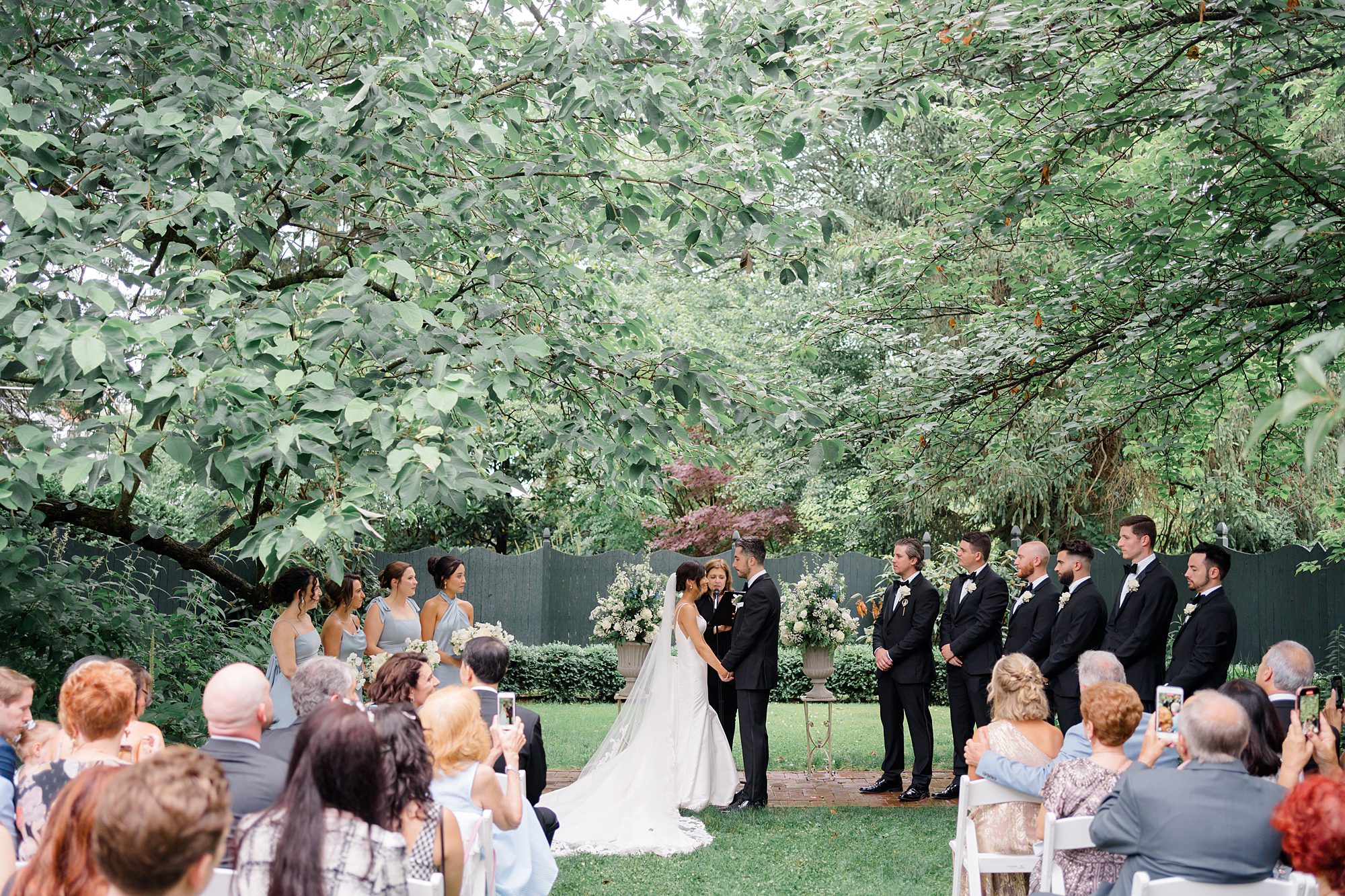couple exchange vows during Timeless New Jersey Wedding at The Inn at Fernbrook Farms 