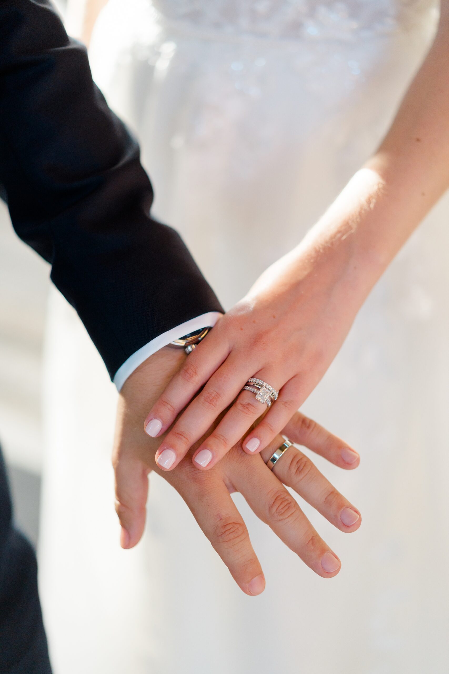 newlyweds show off wedding rings