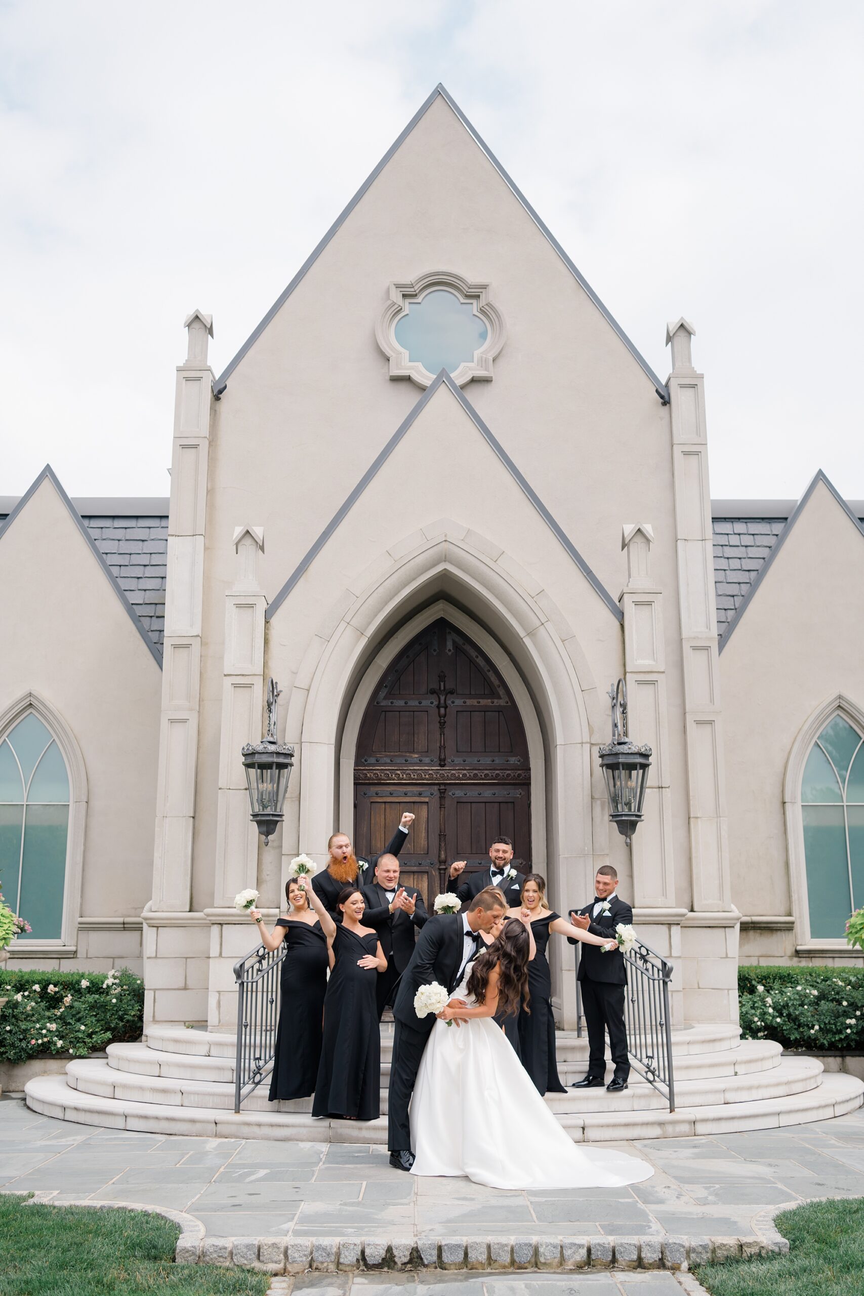wedding party portraits on steps of chapel