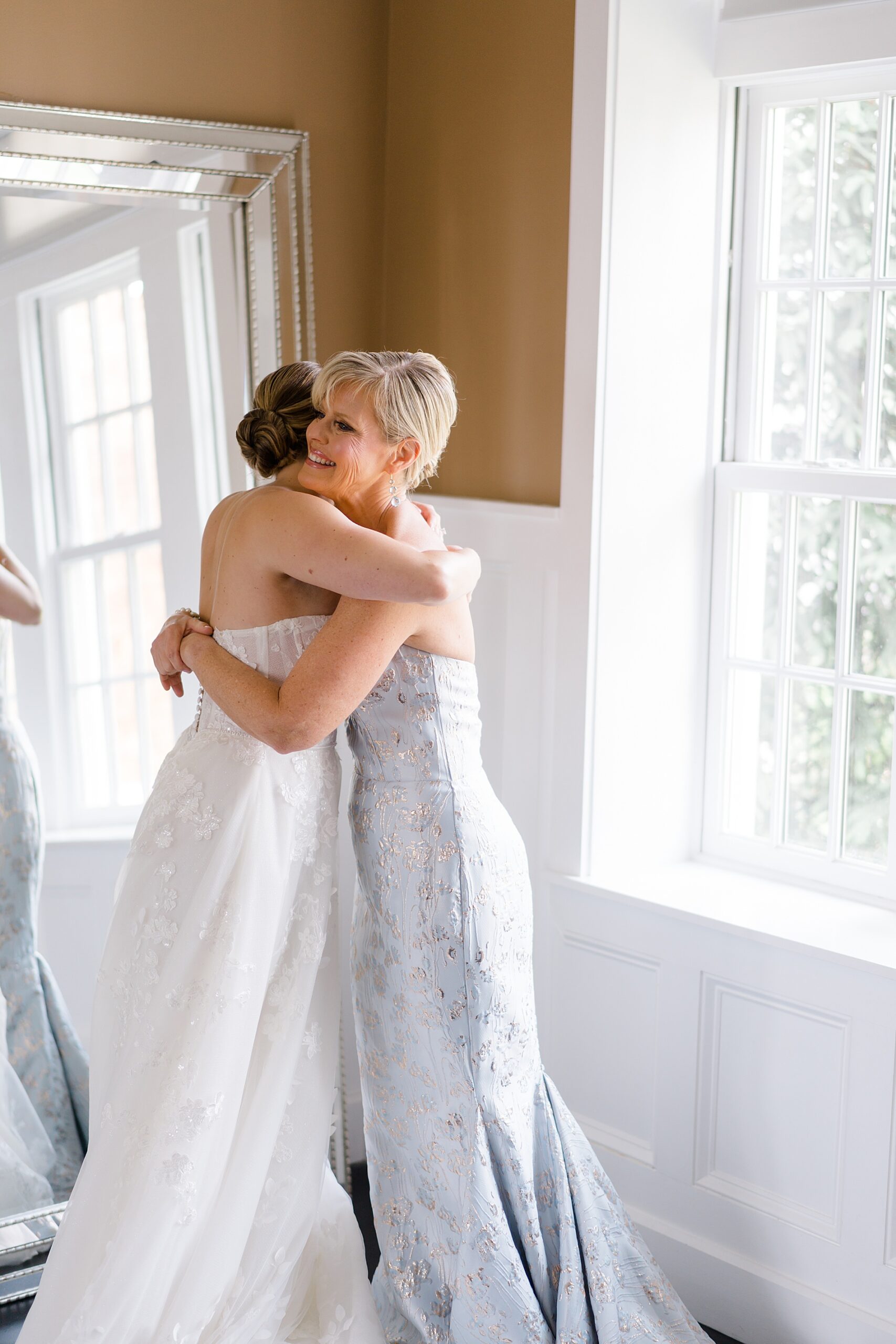 bride hugs her mom