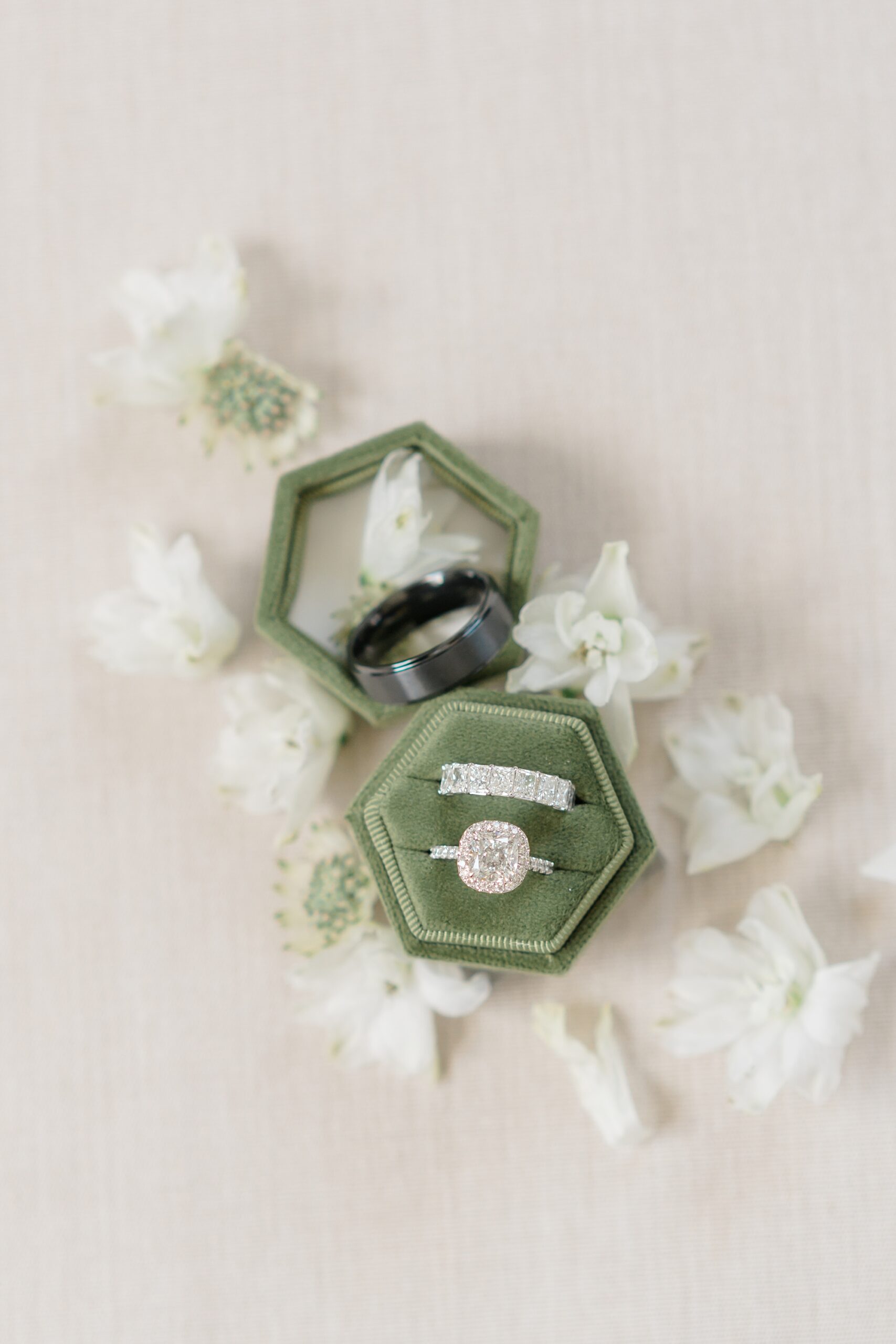 wedding rings inside olive green ring box