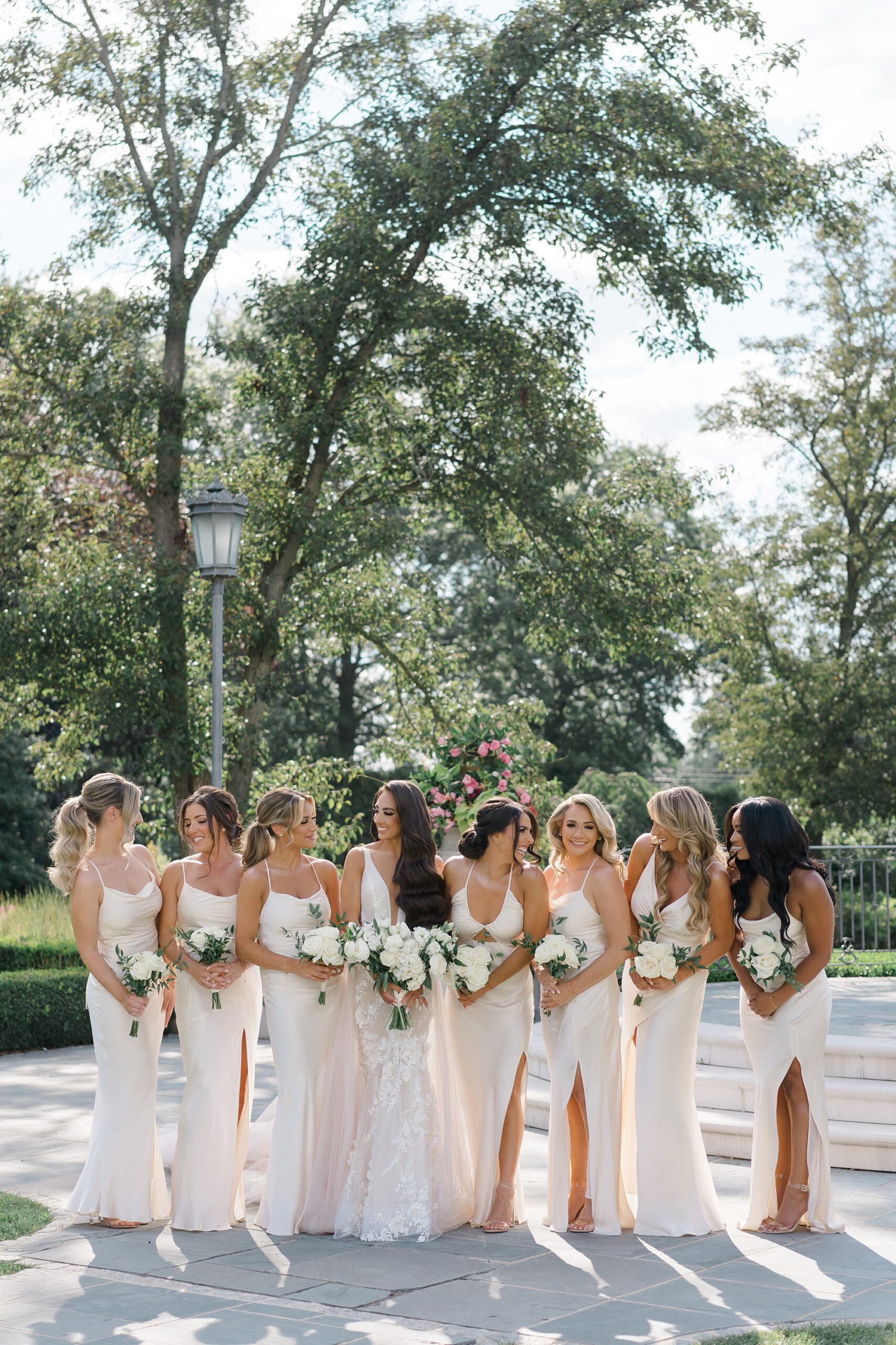 bridal party portraits in timeless, chic white satin dresses 