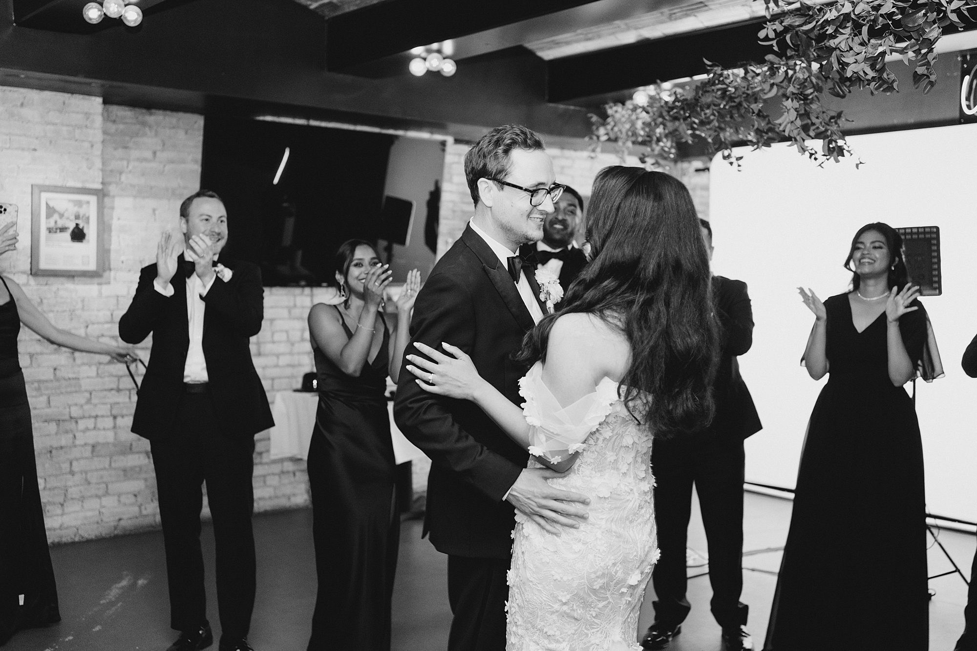bride and groom share first dance together