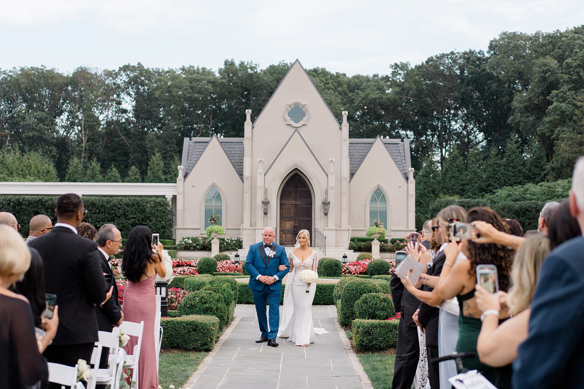 bride and father walking down the aisle at Romantic Park Chateau Wedding